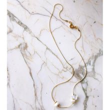 Load image into Gallery viewer, Full view of asymmetric opal necklace on marble table