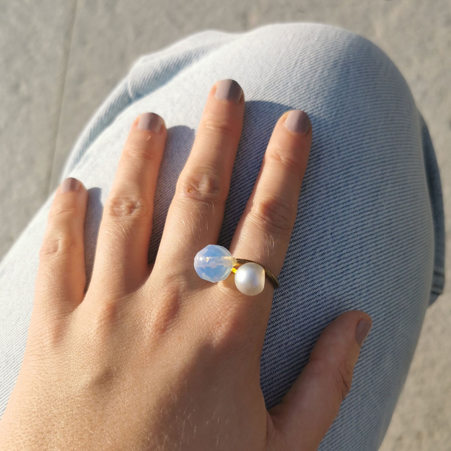 Opal and Pearl ring worn on