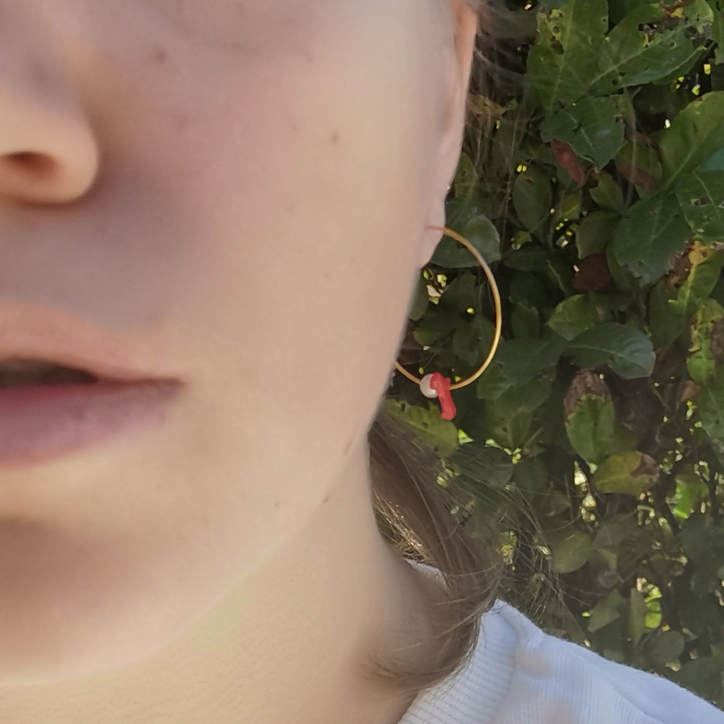 Coral and pearl hoops worn on