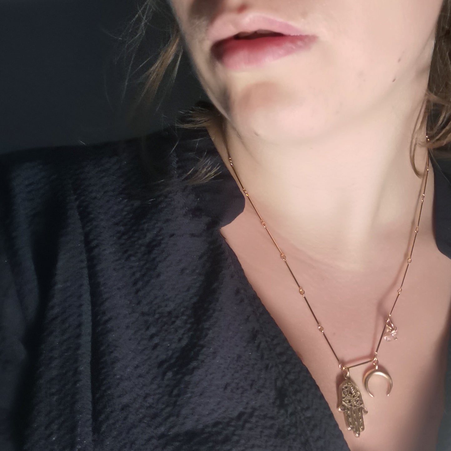 Fatima half moon rose quartz necklace worn on