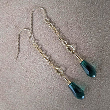 Load image into Gallery viewer, Green swarowski crystals hanging from cable chain earrings. Gold plated twisted hooks