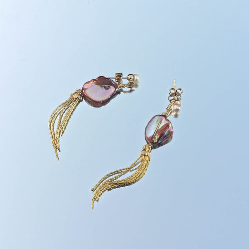Tassle earrings with orange shell and freshwater bead reflected in sky
