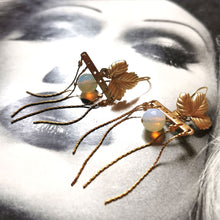 Load image into Gallery viewer, Opal leaf earrings on Vogue background