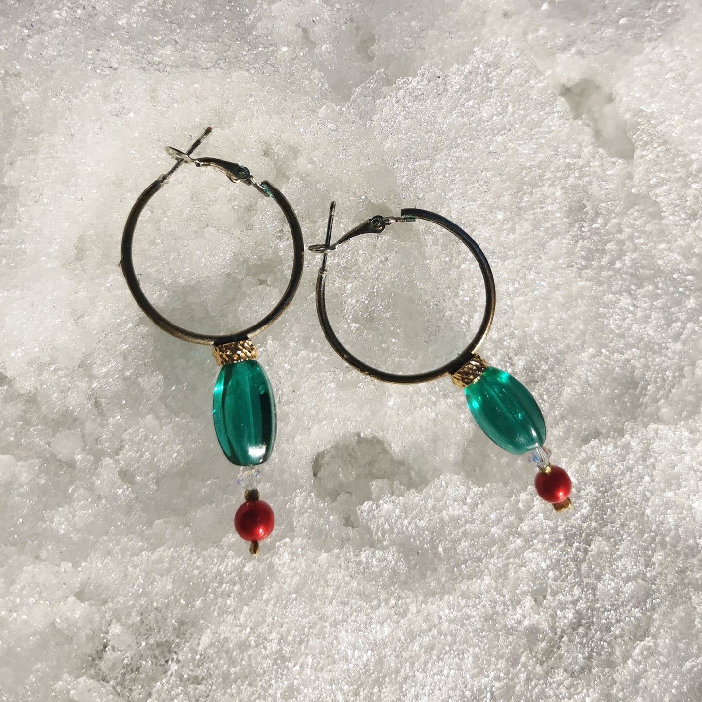 3cm hoops with green beads, gold detail, Swarowski crystal and boheme red pearl pictured in the snow