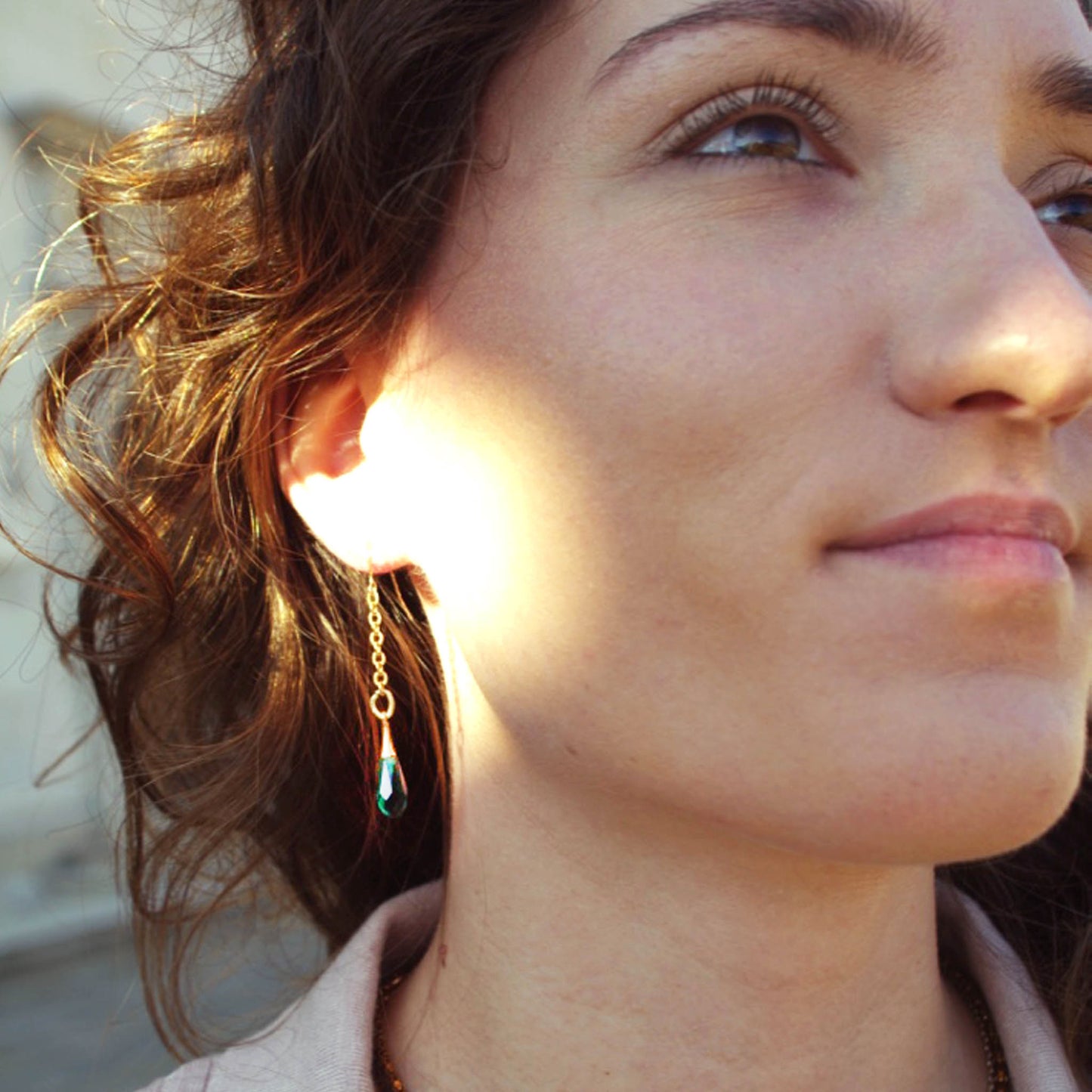Valerie wearing green teardrop earrings