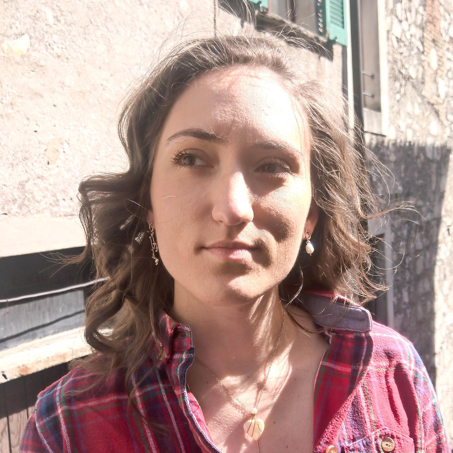 Stargazer earring as worn on - mismatch earrings with same stud and pearl theme