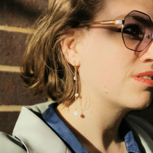 Load image into Gallery viewer, Shell drop earrings worn on