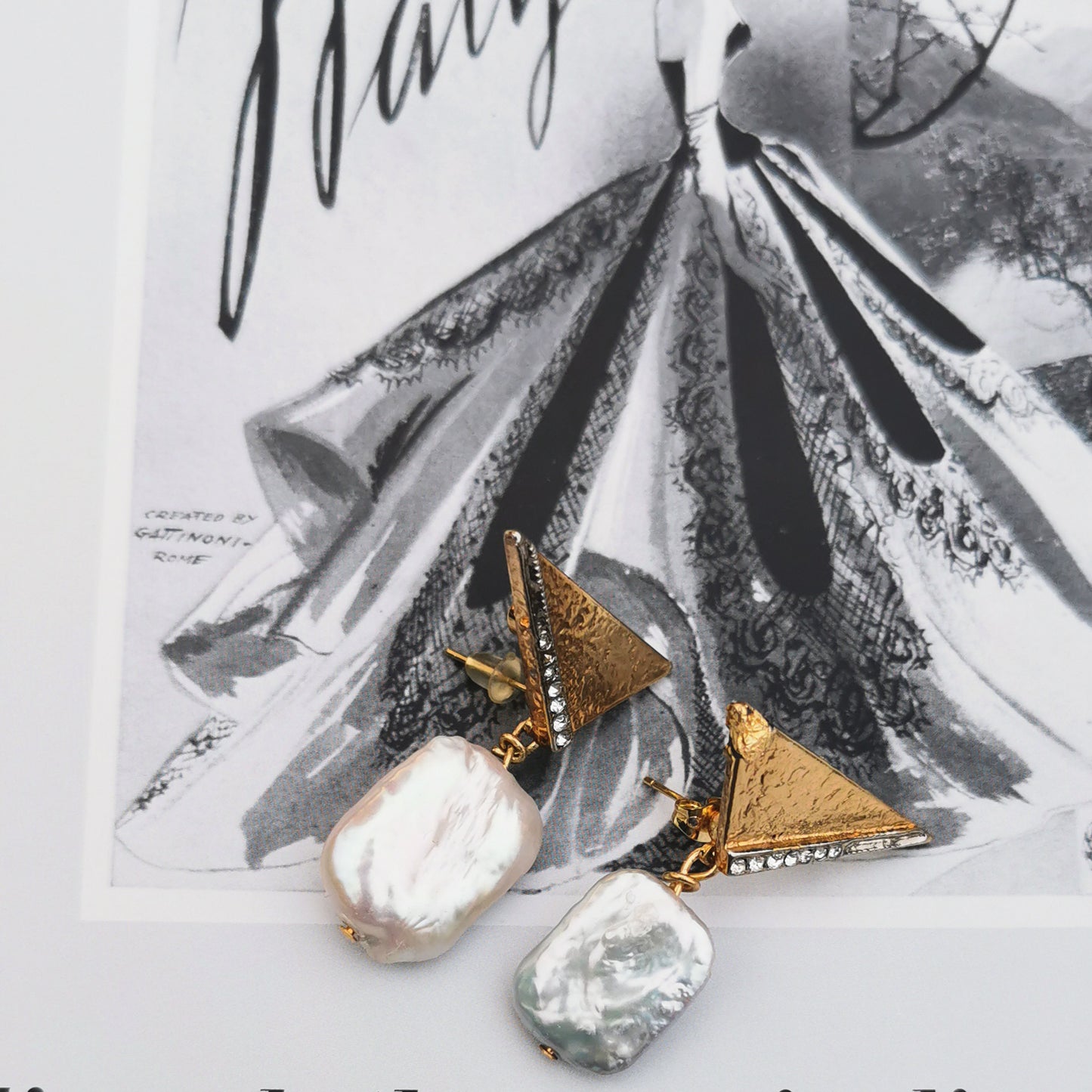 Baroque Pearl on retro stud with vintage book background