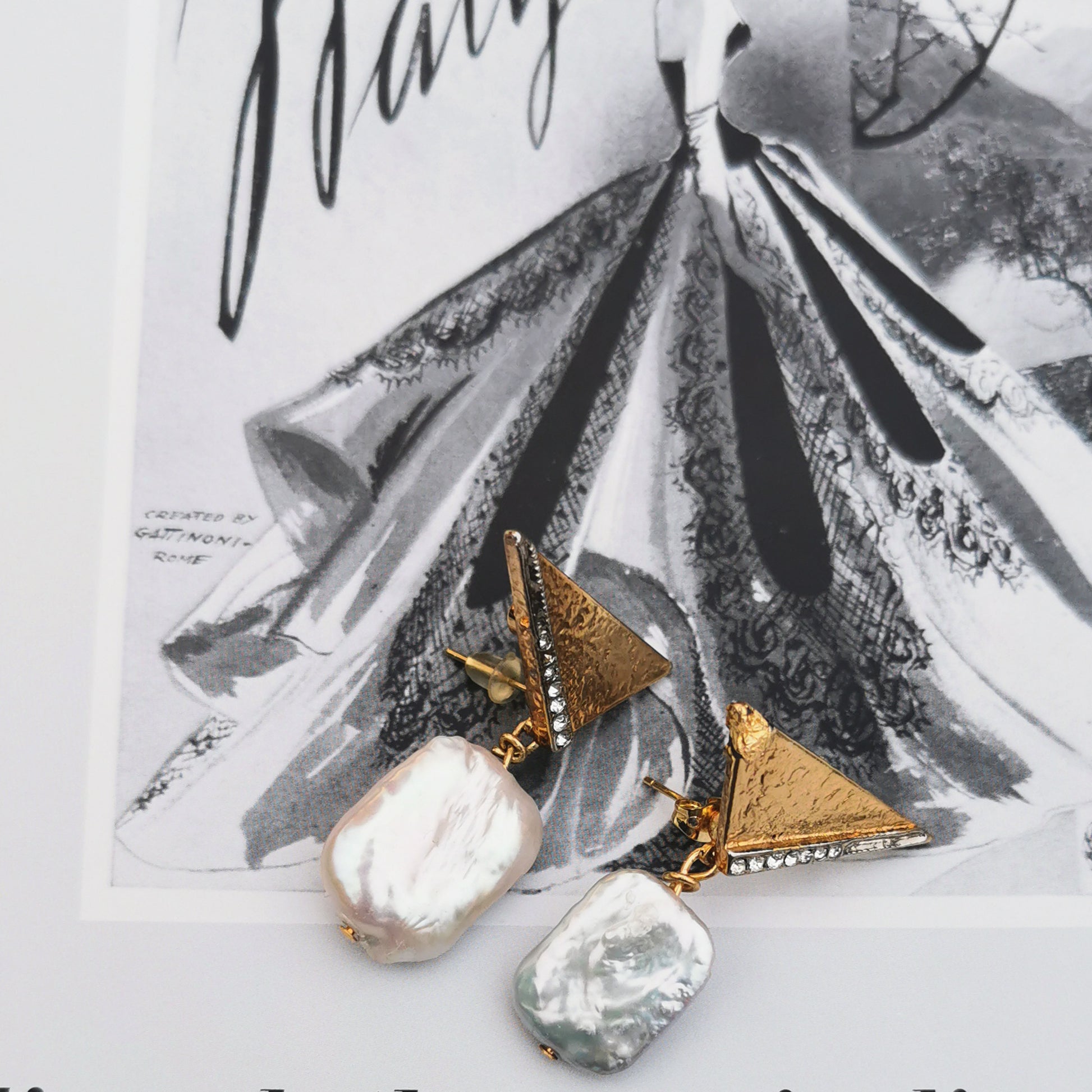 Baroque Pearl on retro stud with vintage book background