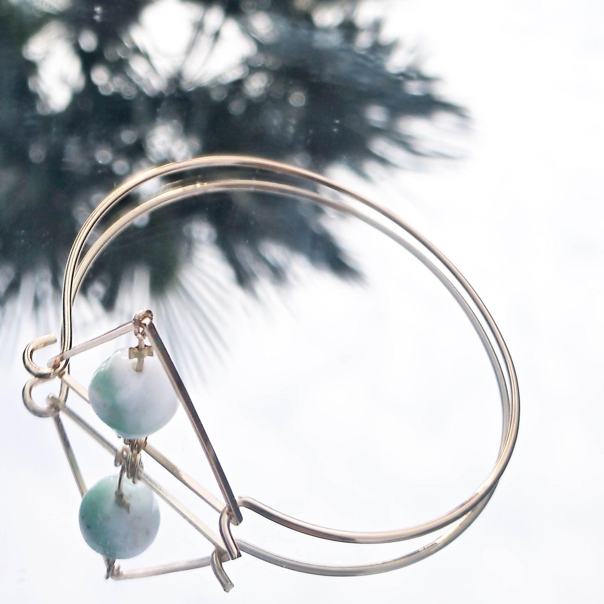 Bermuda Triangle Bangle reflection with palmtree