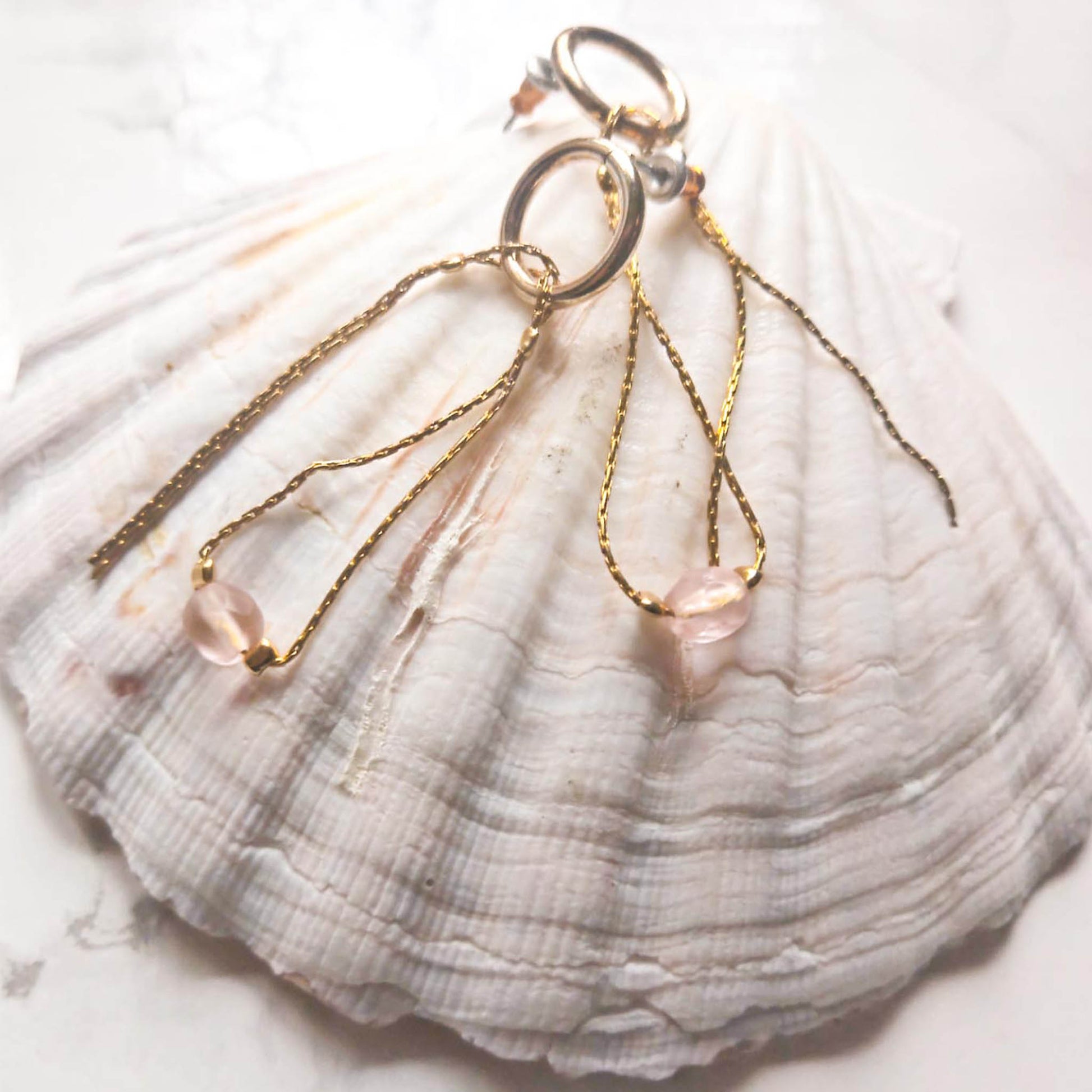 Stud earrings with pendant chains and pink beads