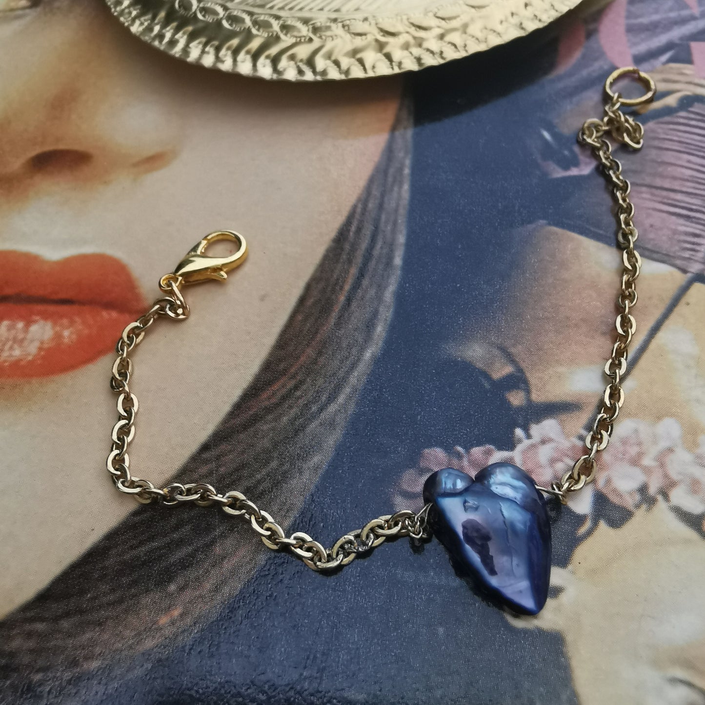 Blue kishi bracelet photographed on book 