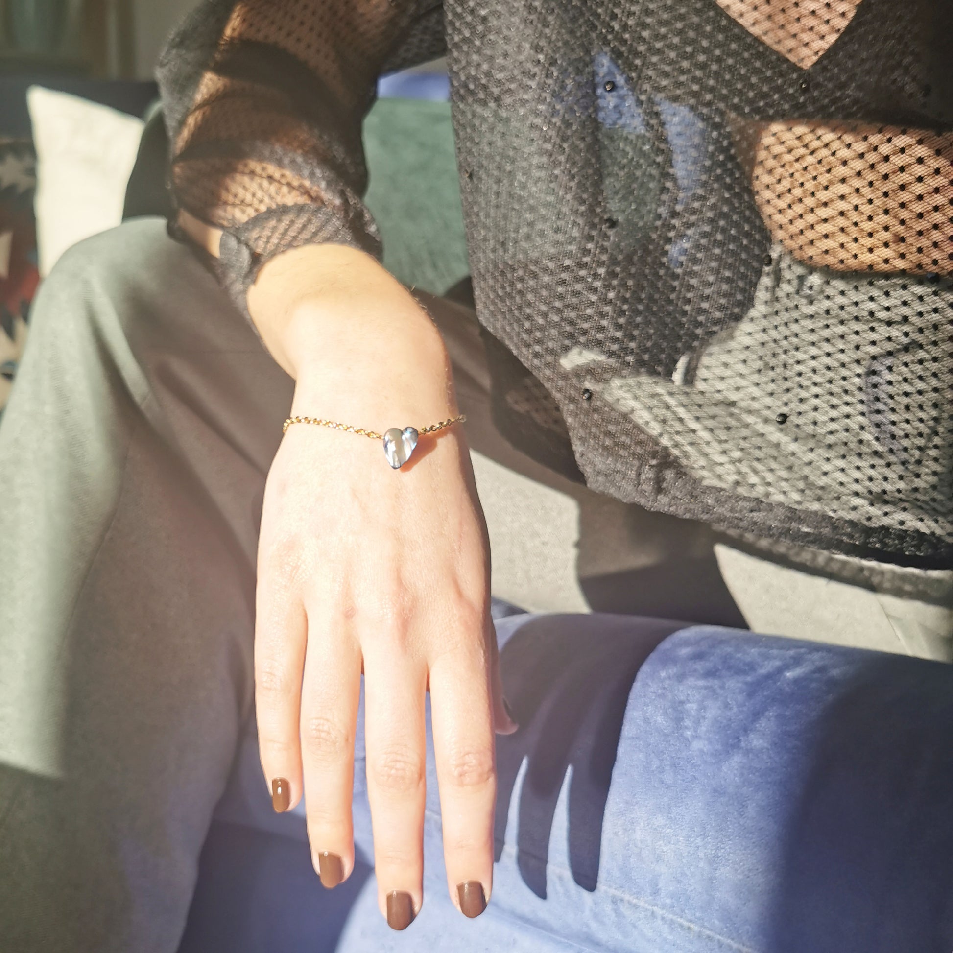 Blue kishi bracelet worn on 