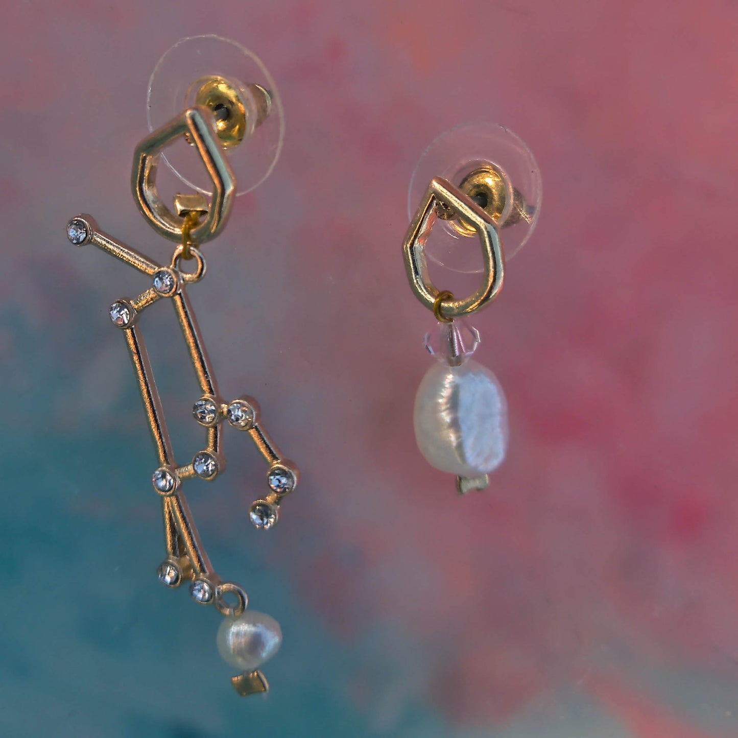 Mismatch Earrings with stellar sign freshwater pearls and swarowski crystals Camifolla background