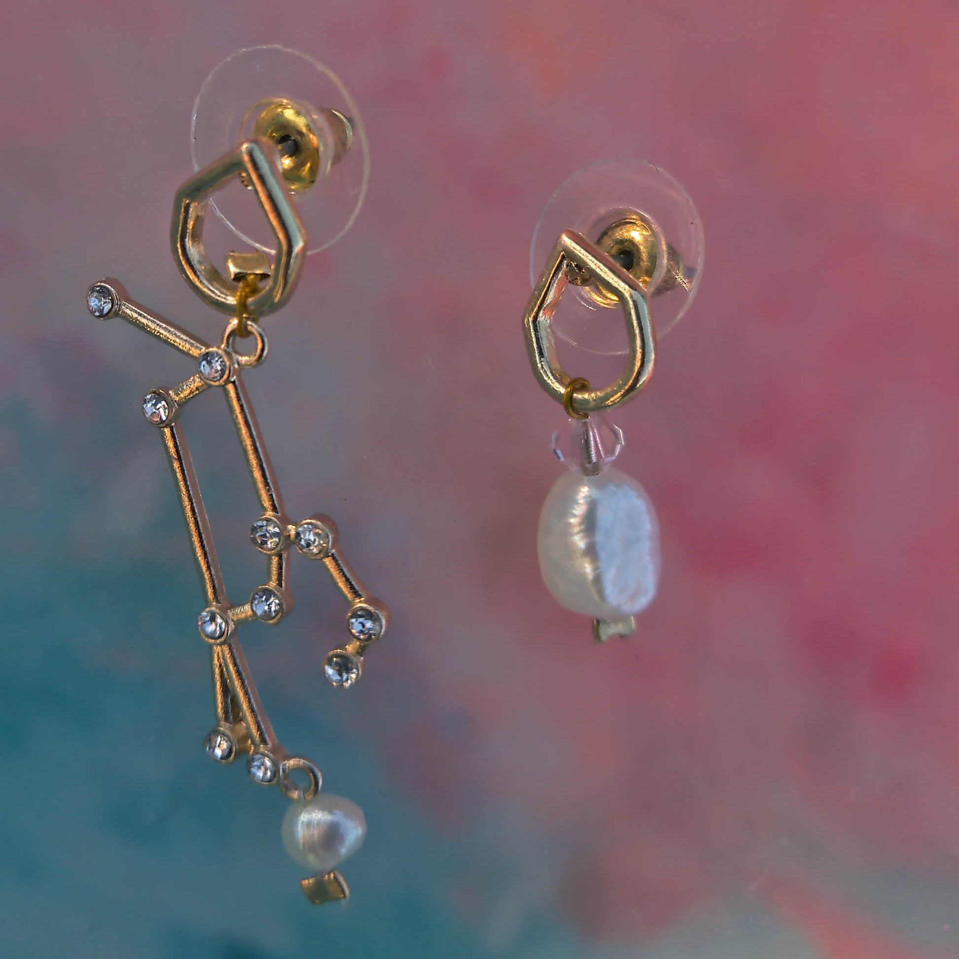 Mismatch Earrings with stellar sign freshwater pearls and swarowski crystals Camifolla background