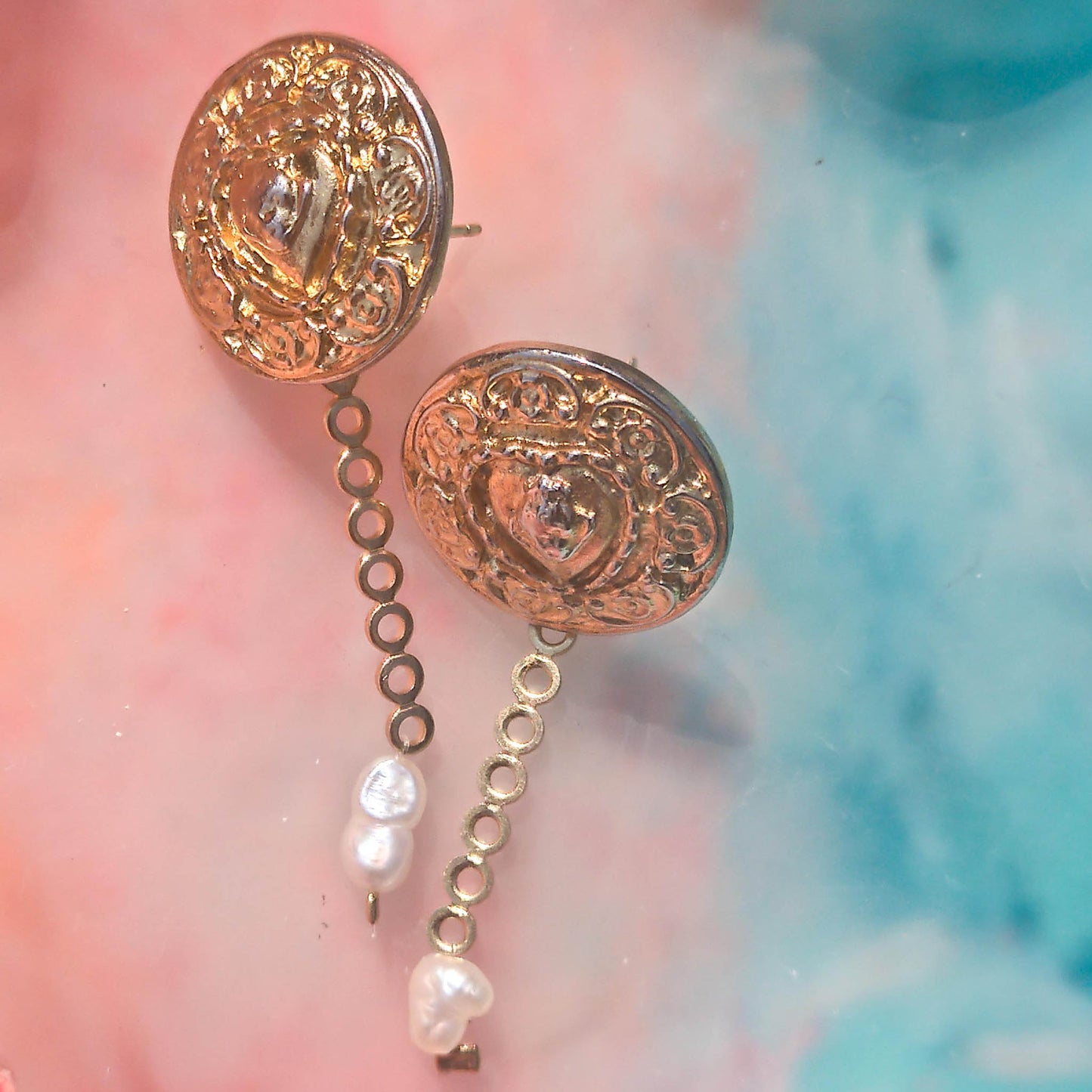 Donatella earrings- textured stud earrings with dainty freshwater pearl detail on Camifolla background