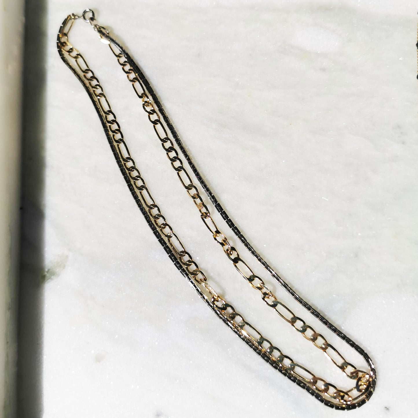 Silver and gold coloured layered chain 