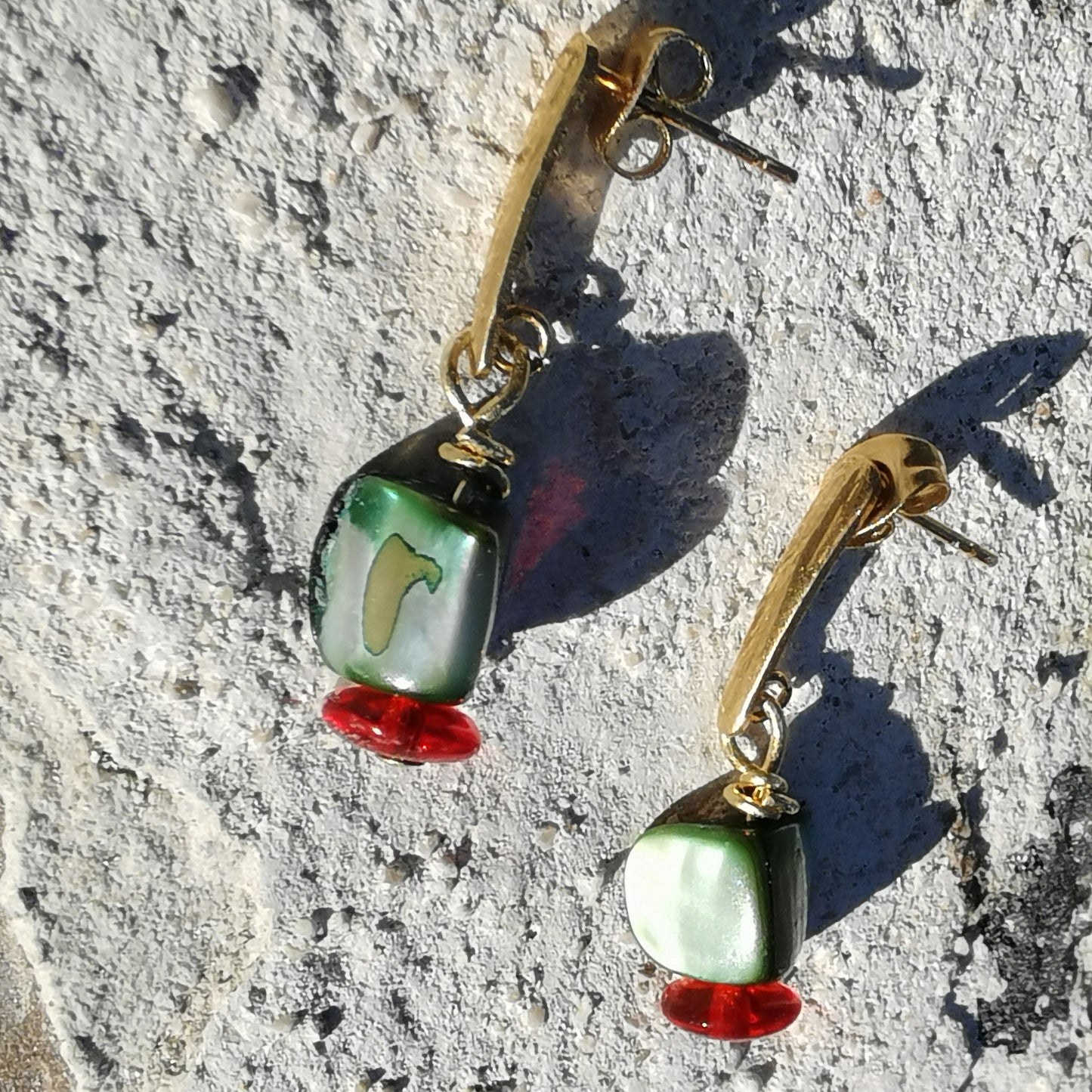 Green shells and red beads 