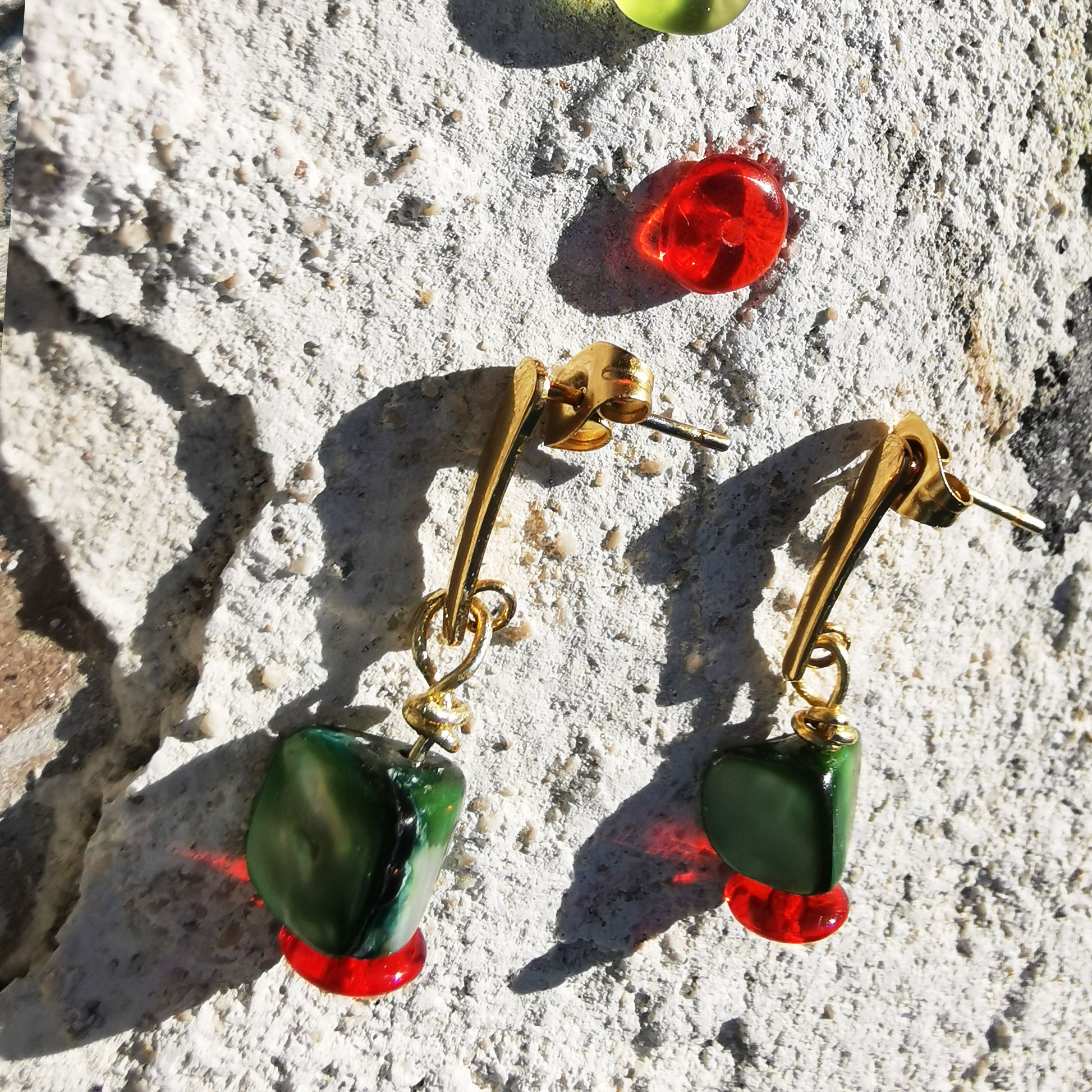 Beads with green shells and red beads