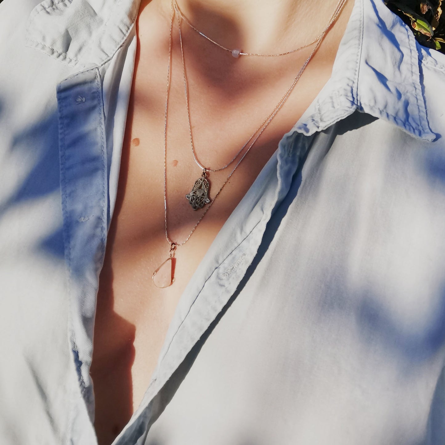 Fatima hand necklace worn on 