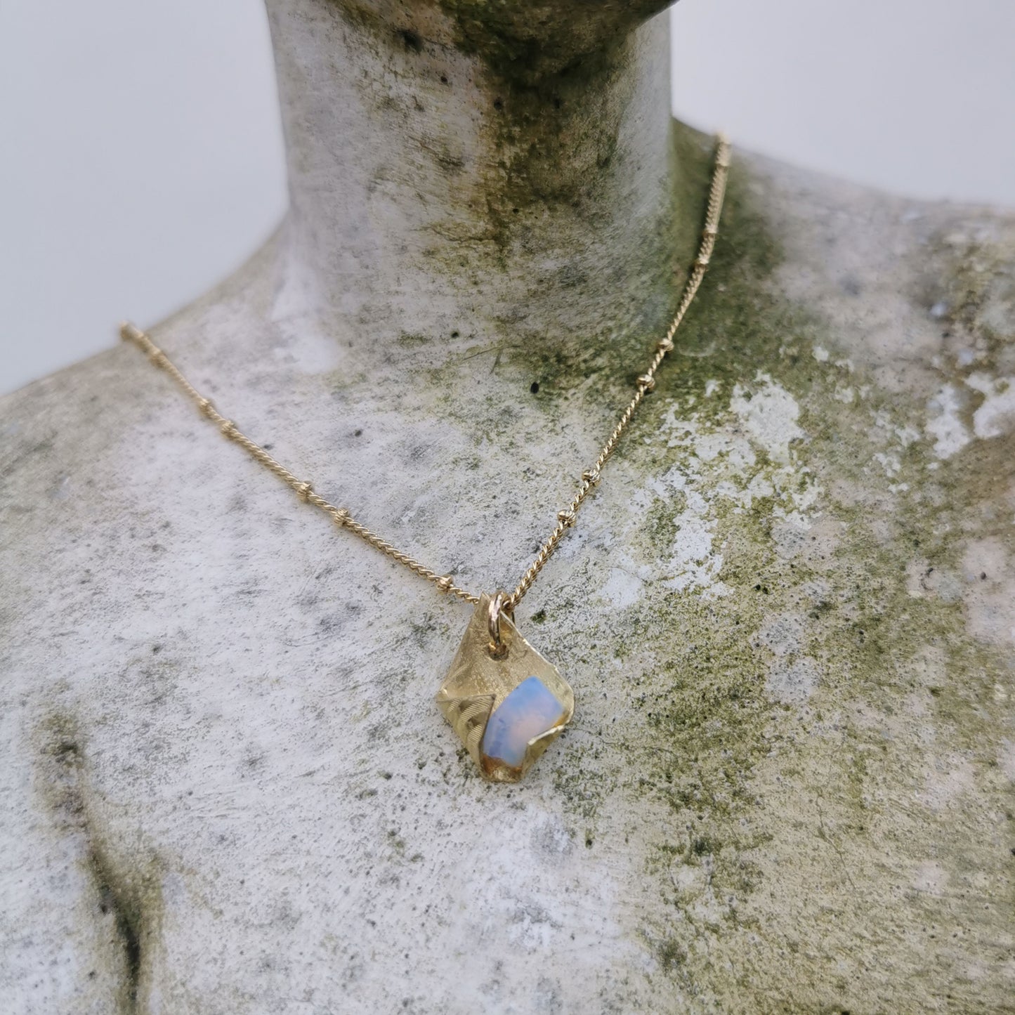 Brass and Opal charm necklace worn on Venus