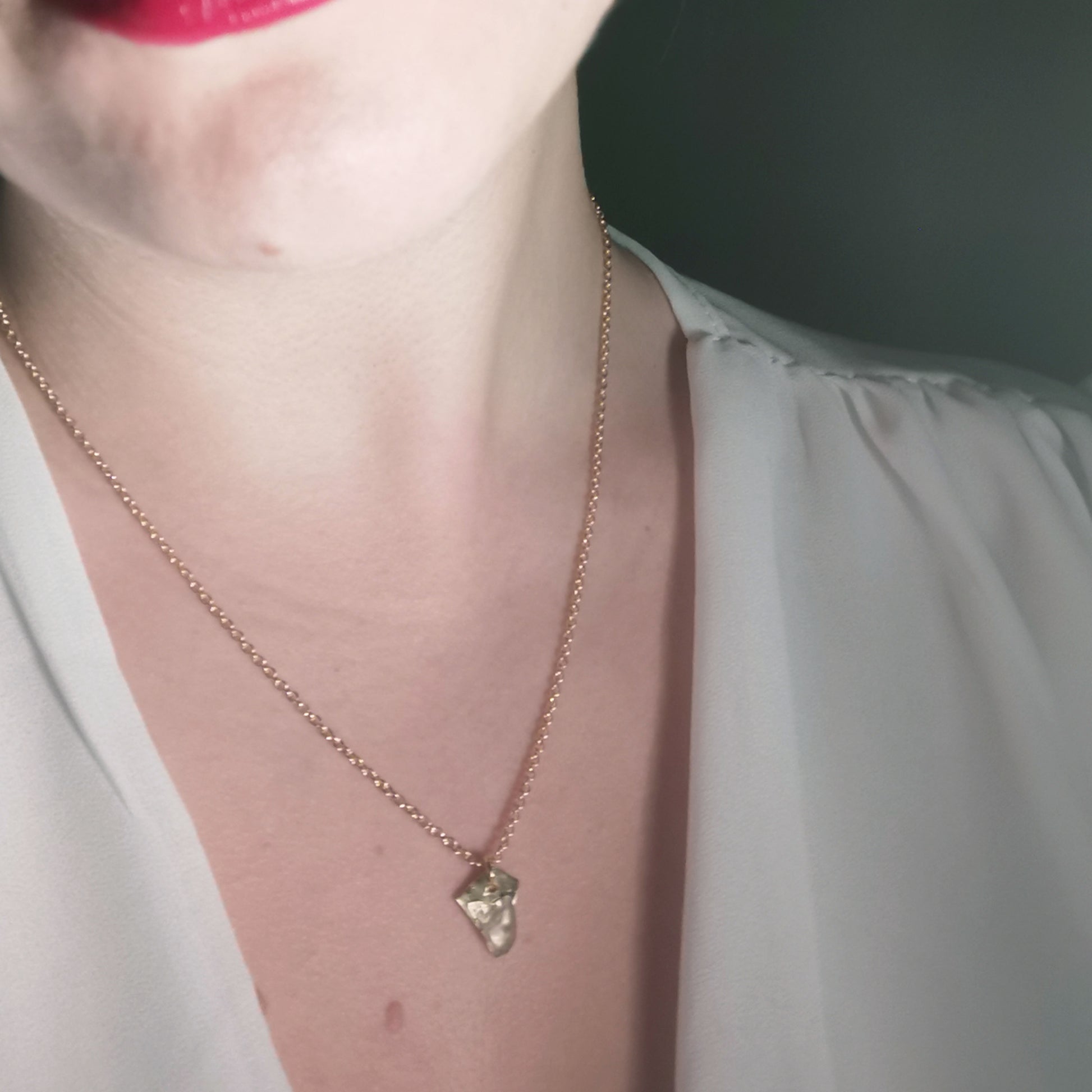 Fortune cookie fluorite necklace worn on 