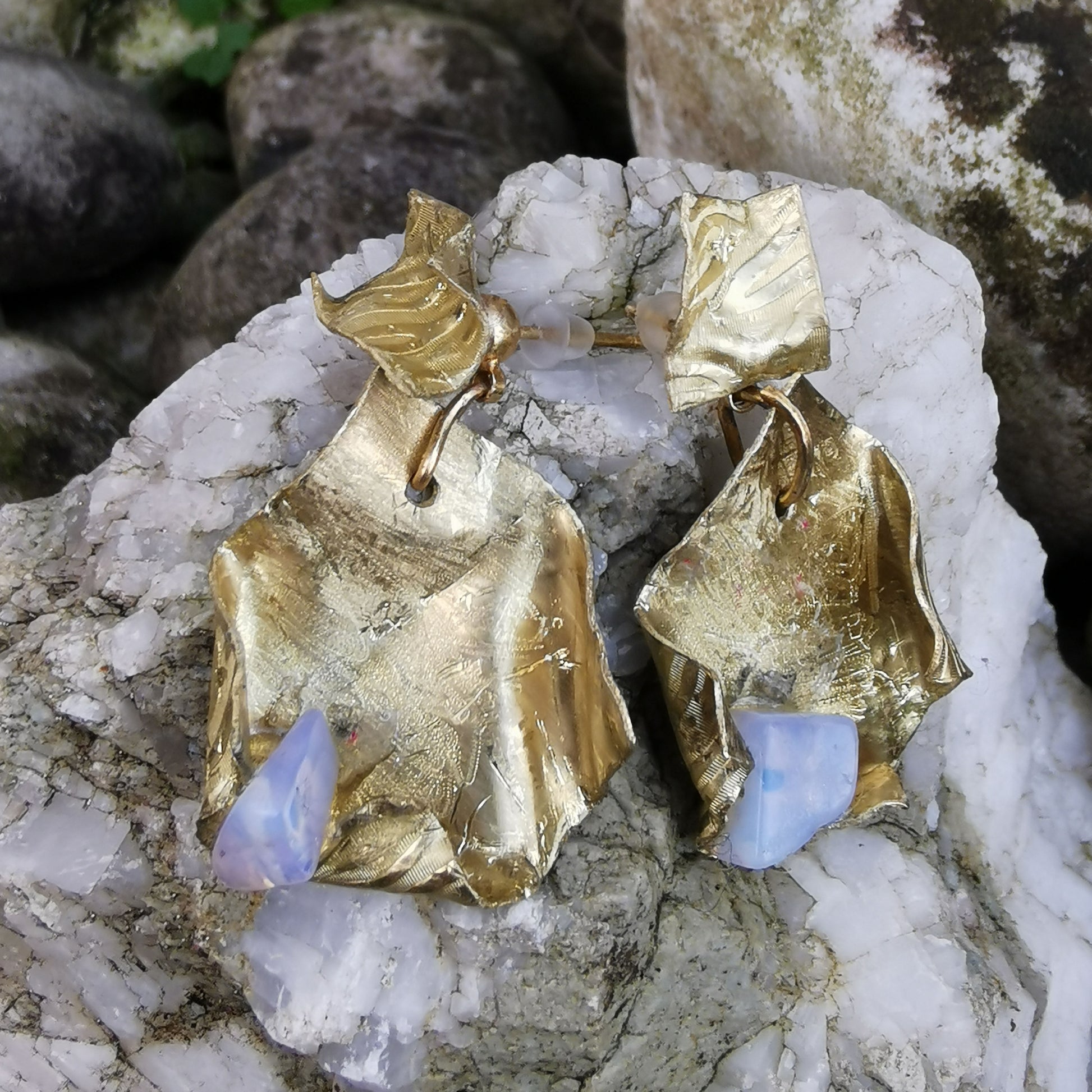 Fortune cookie earring on rock