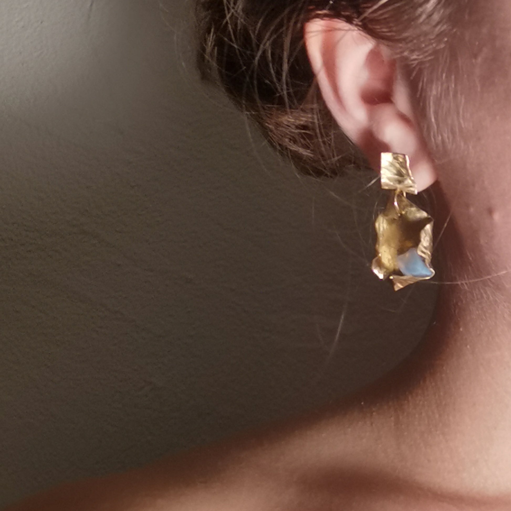 Fortune Cookie earring worn on