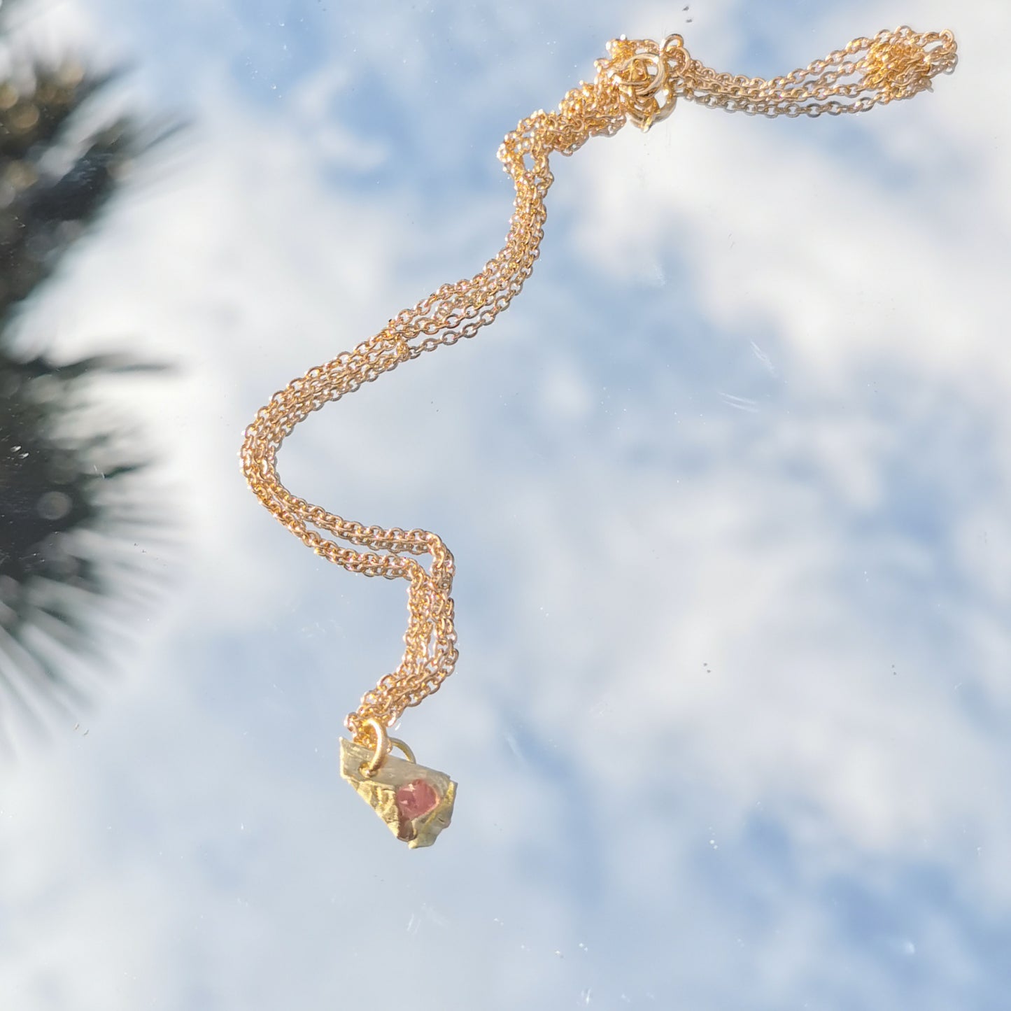 Swarowski and brass charm with gold plated chain