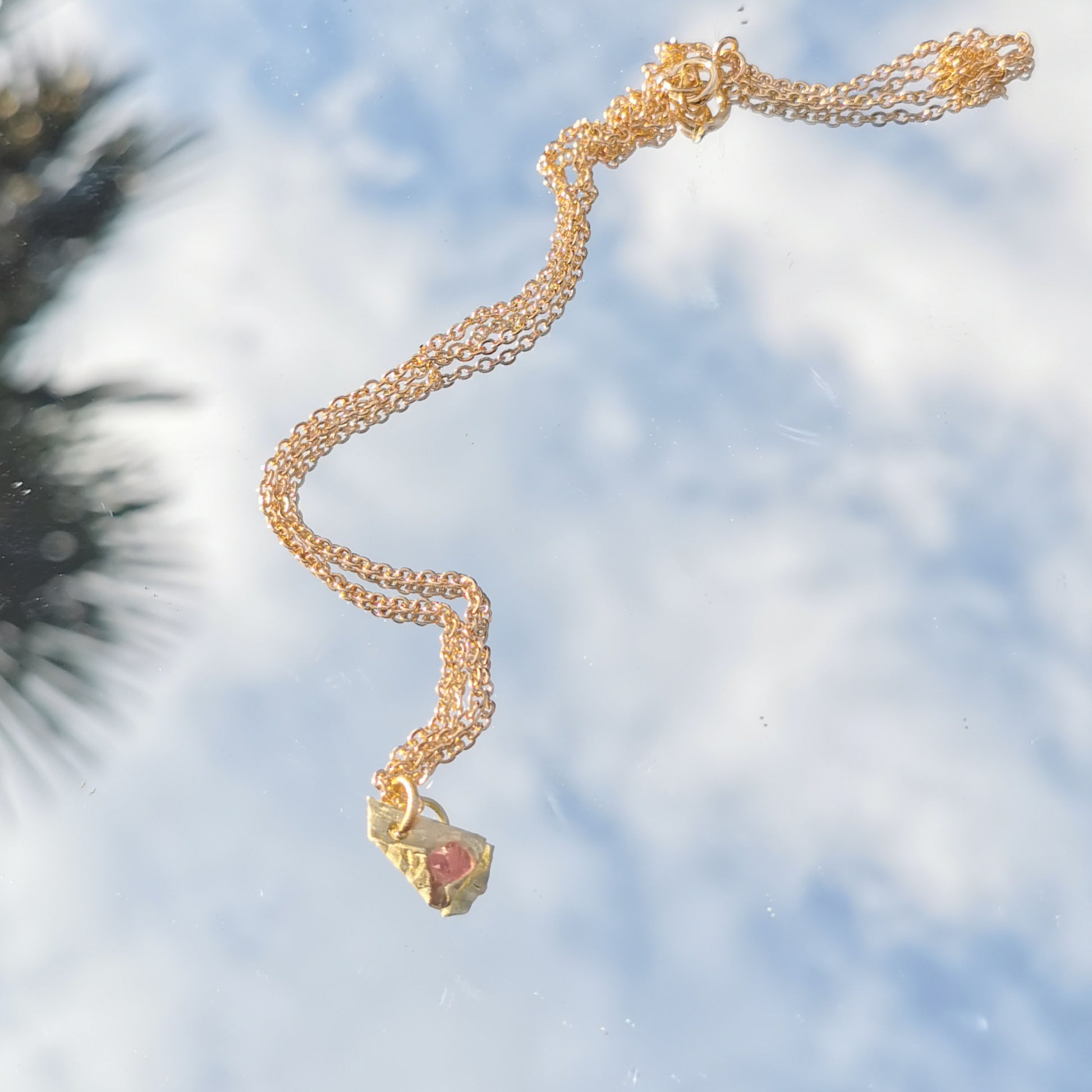 Swarowski and brass charm with gold plated chain