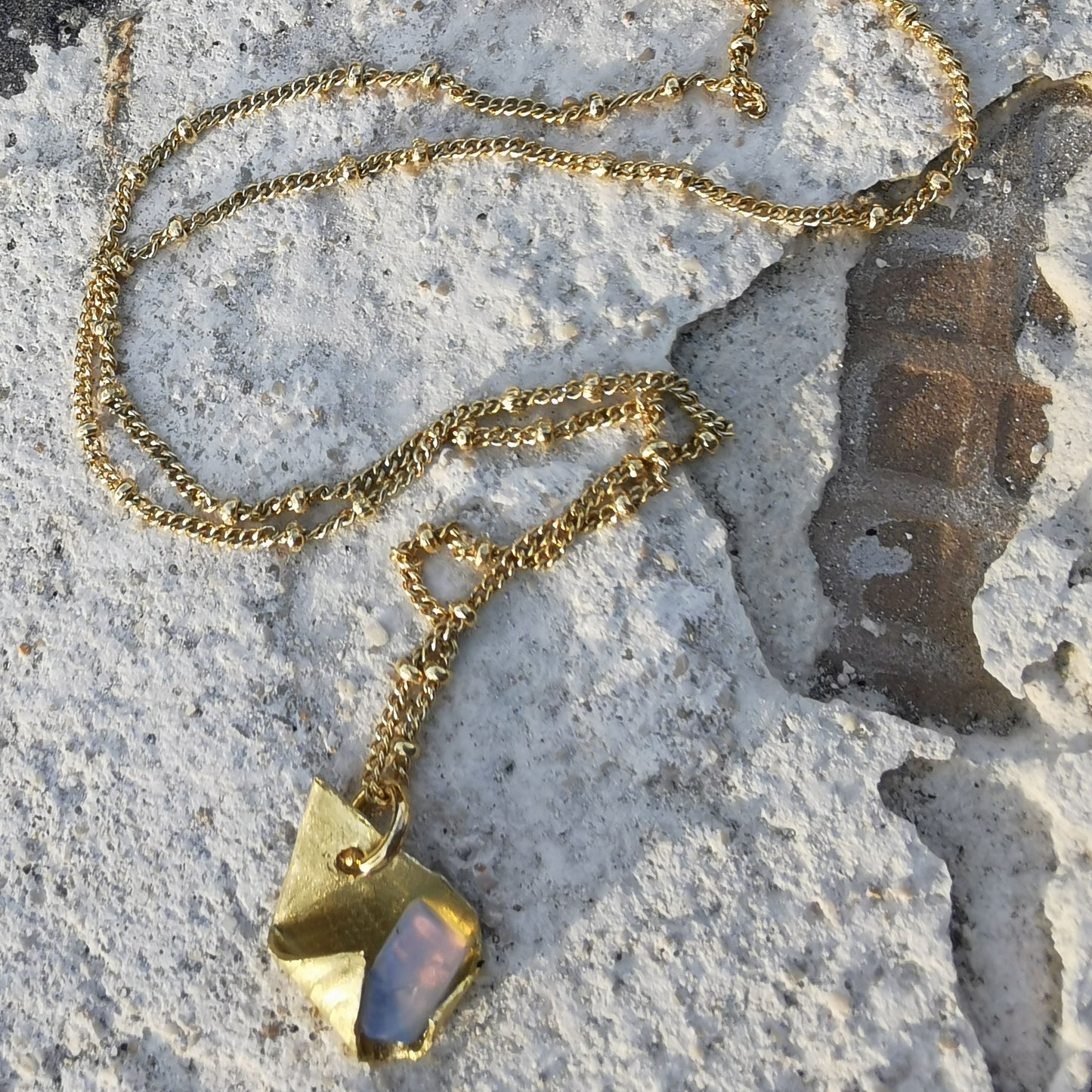 Brass and opal charm  