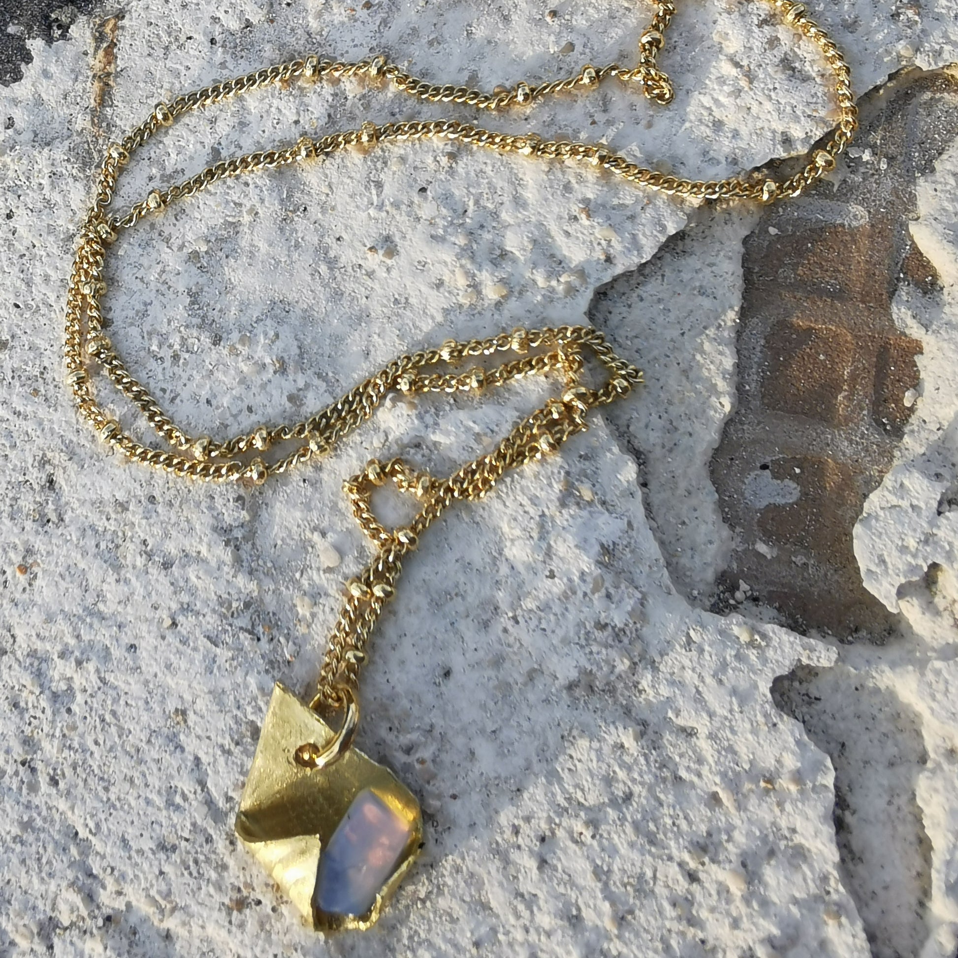 Brass and opal charm  