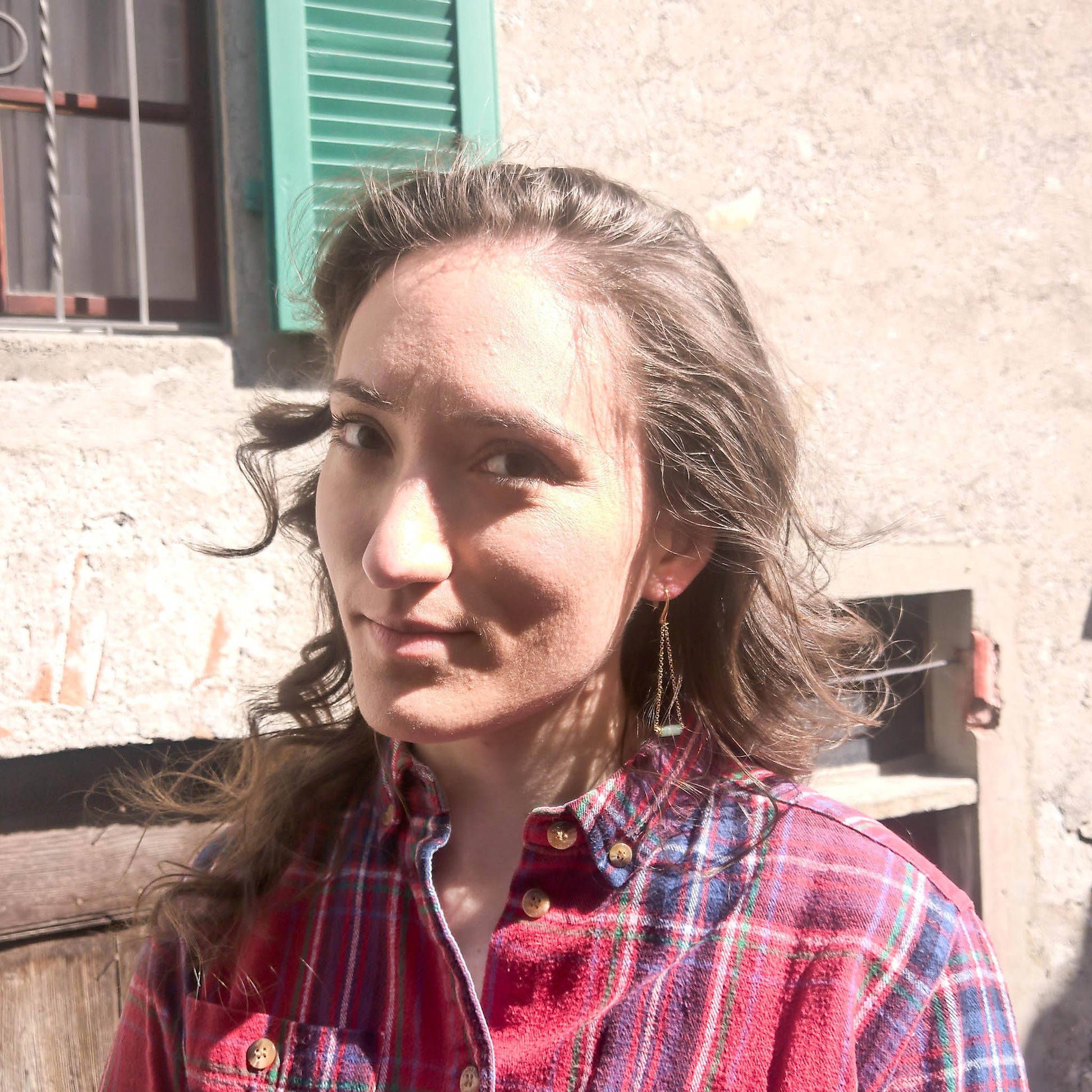 Je T'Amie Mint chain triangle earrings worn on