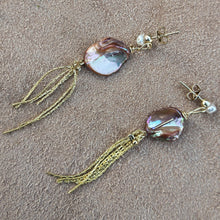 Load image into Gallery viewer, Tassle earrings with orange keshi and freshwater pearls details. 
