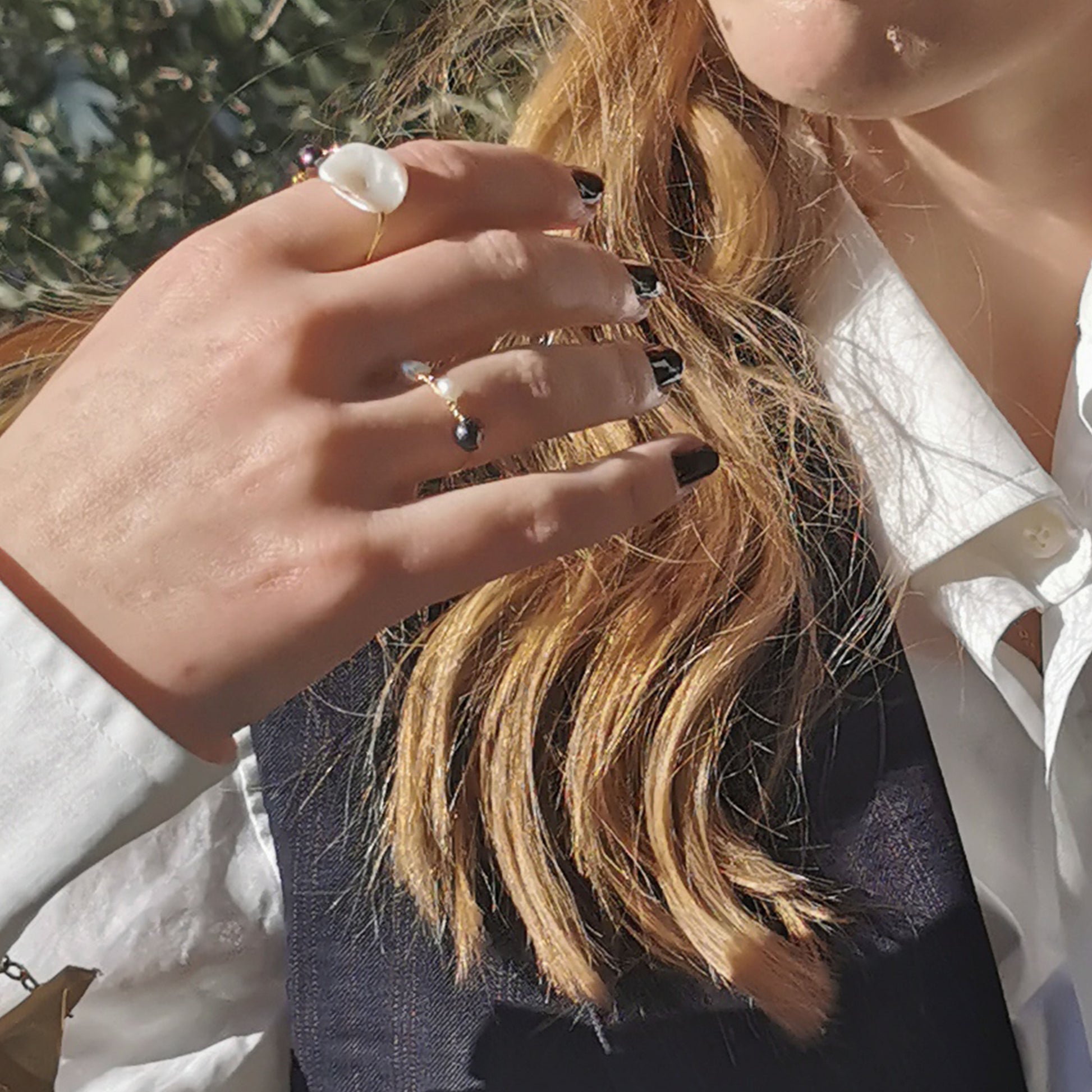 Black and white freshwater pearls ring worn on 