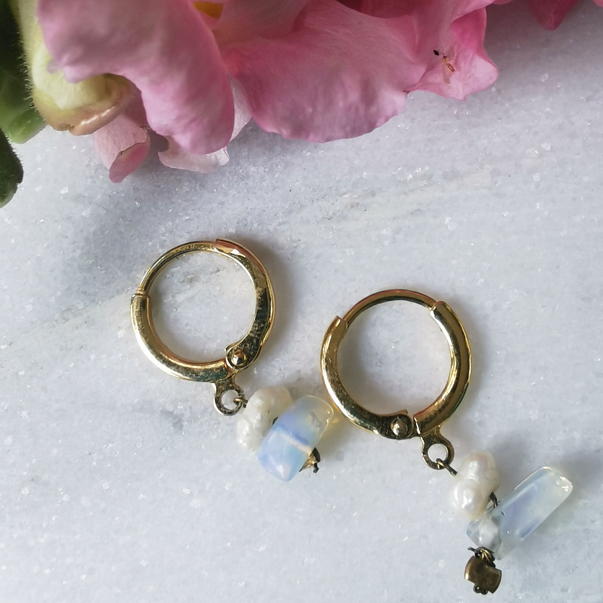 Opal  and freshwater pearl small hoop earrings on marble