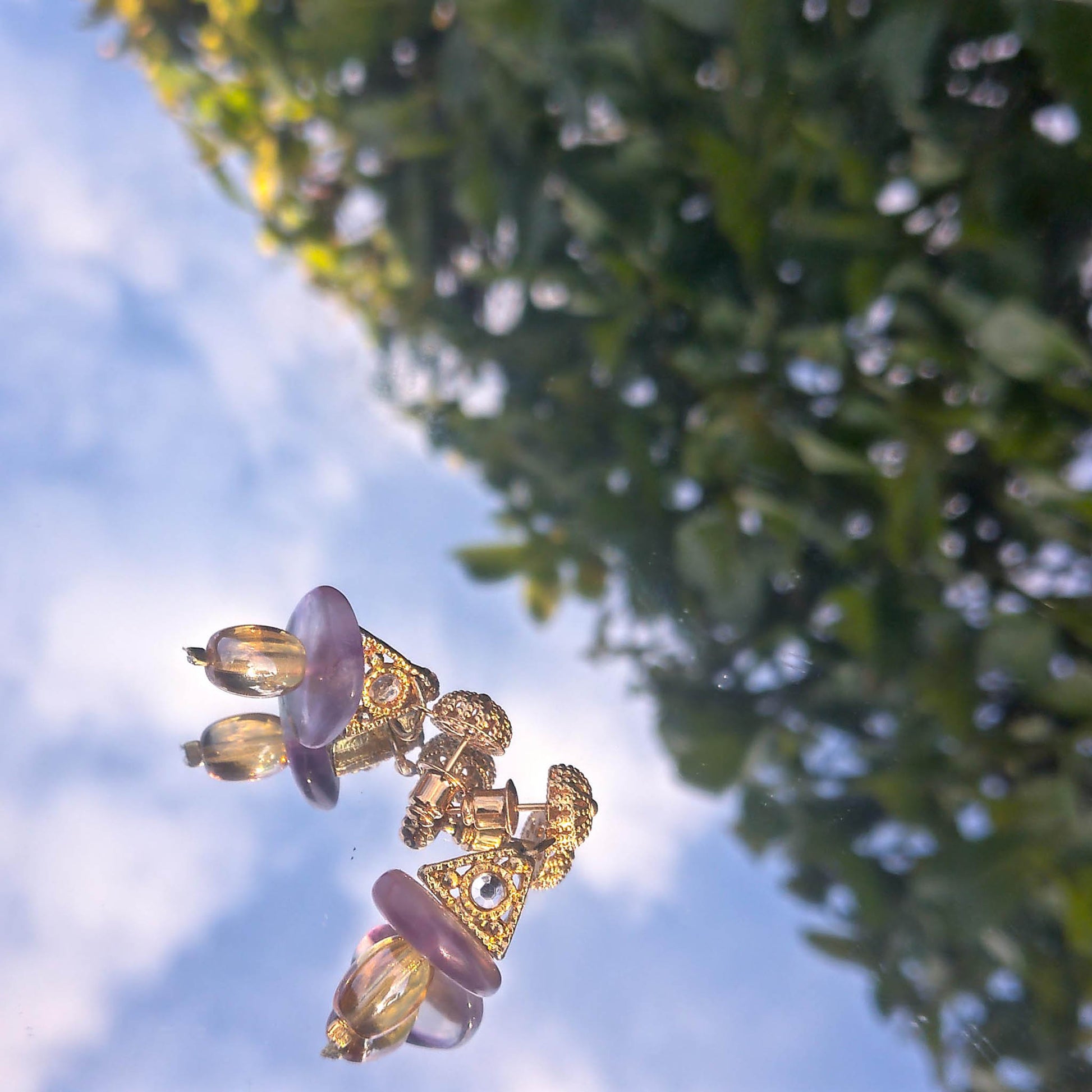 small easter themed earrings with yellow and purple reflection 