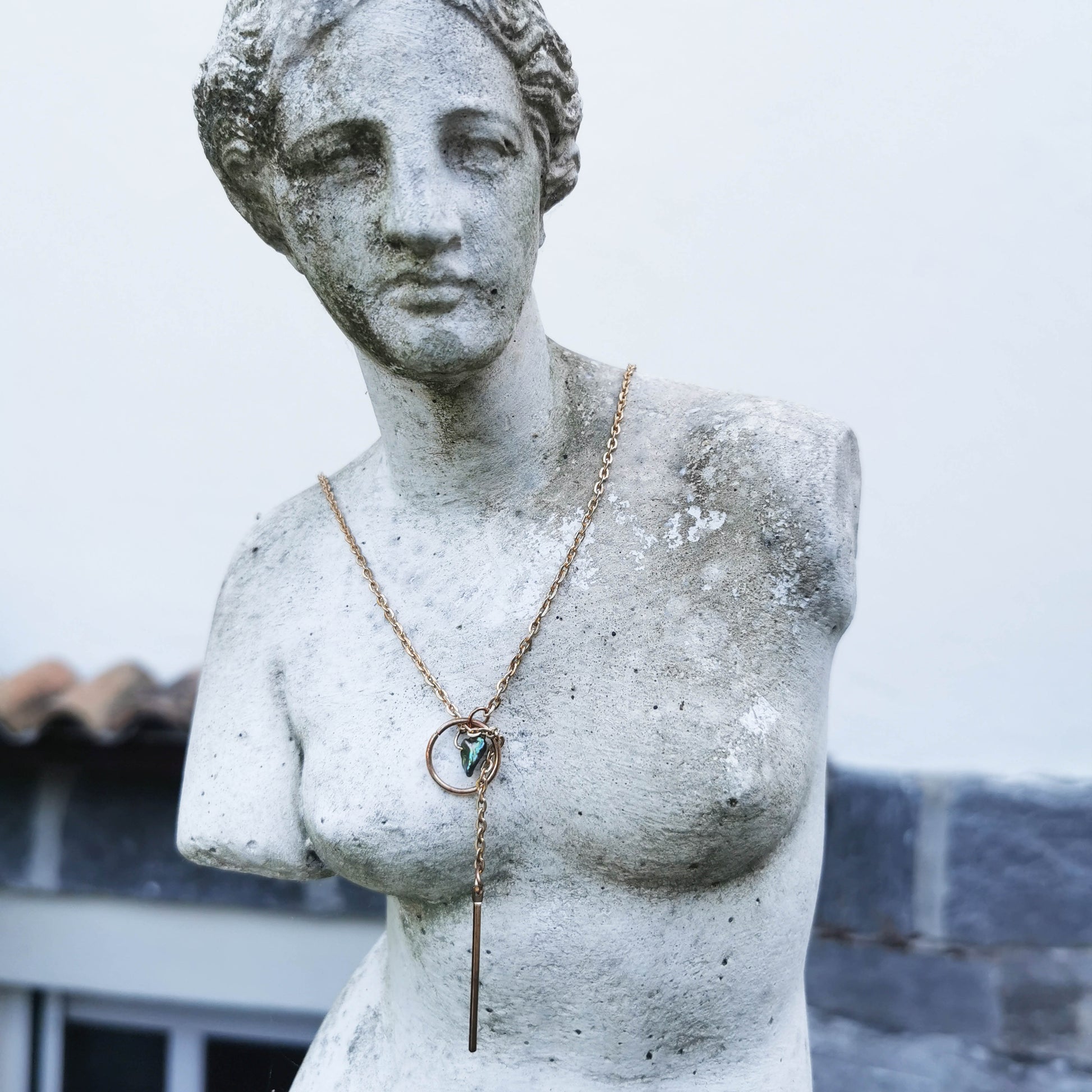 PIstachio lariat necklace worn by Venus statue 