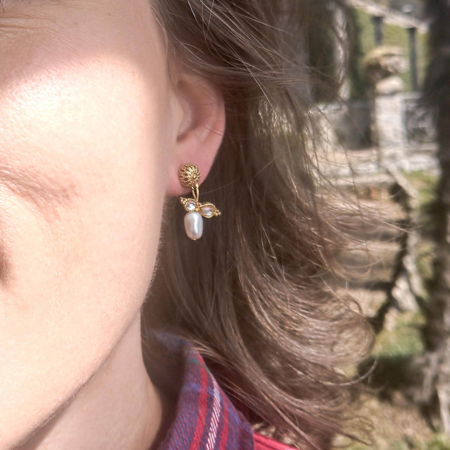 Queen Bee earrings- gold coloured textured studs with freshwater pearl dangle as worn on