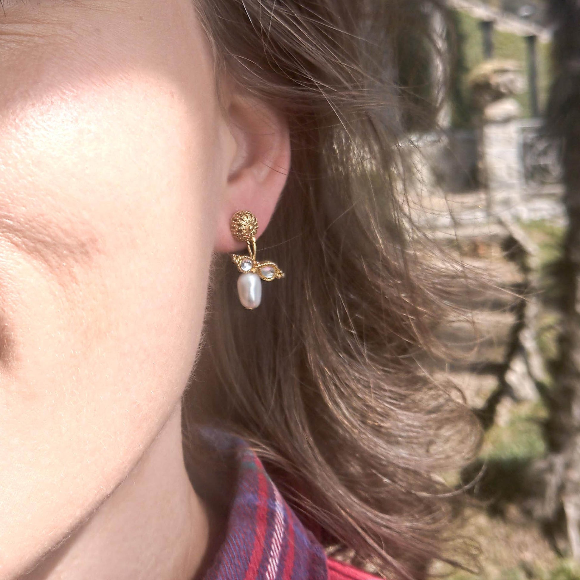 Queen Bee earrings- gold coloured textured studs with freshwater pearl dangle as worn on