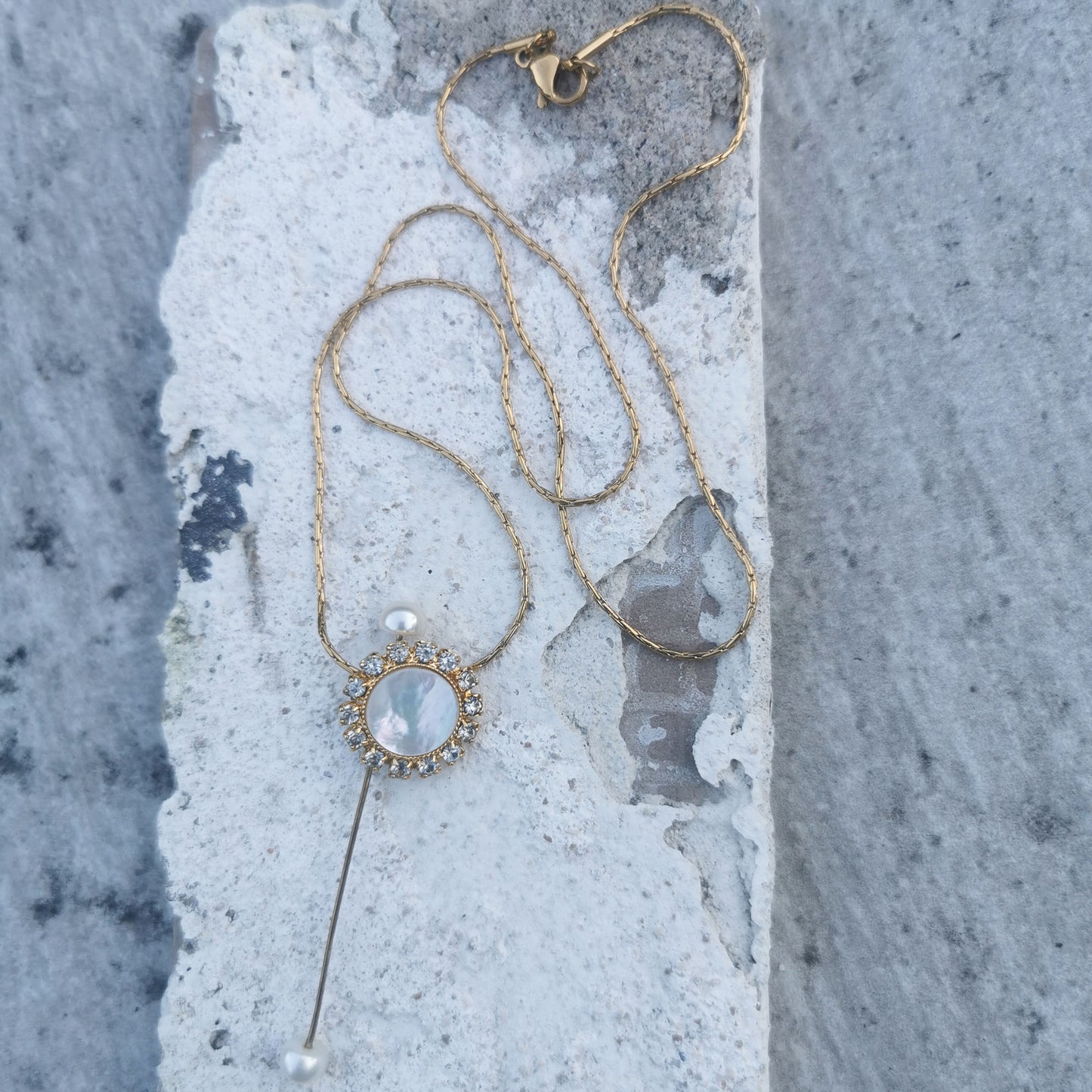 Double Pearl Camifolla signature Necklace on marble