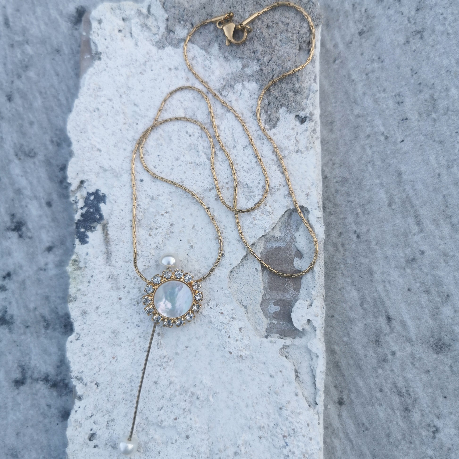 Double Pearl Camifolla signature Necklace on marble