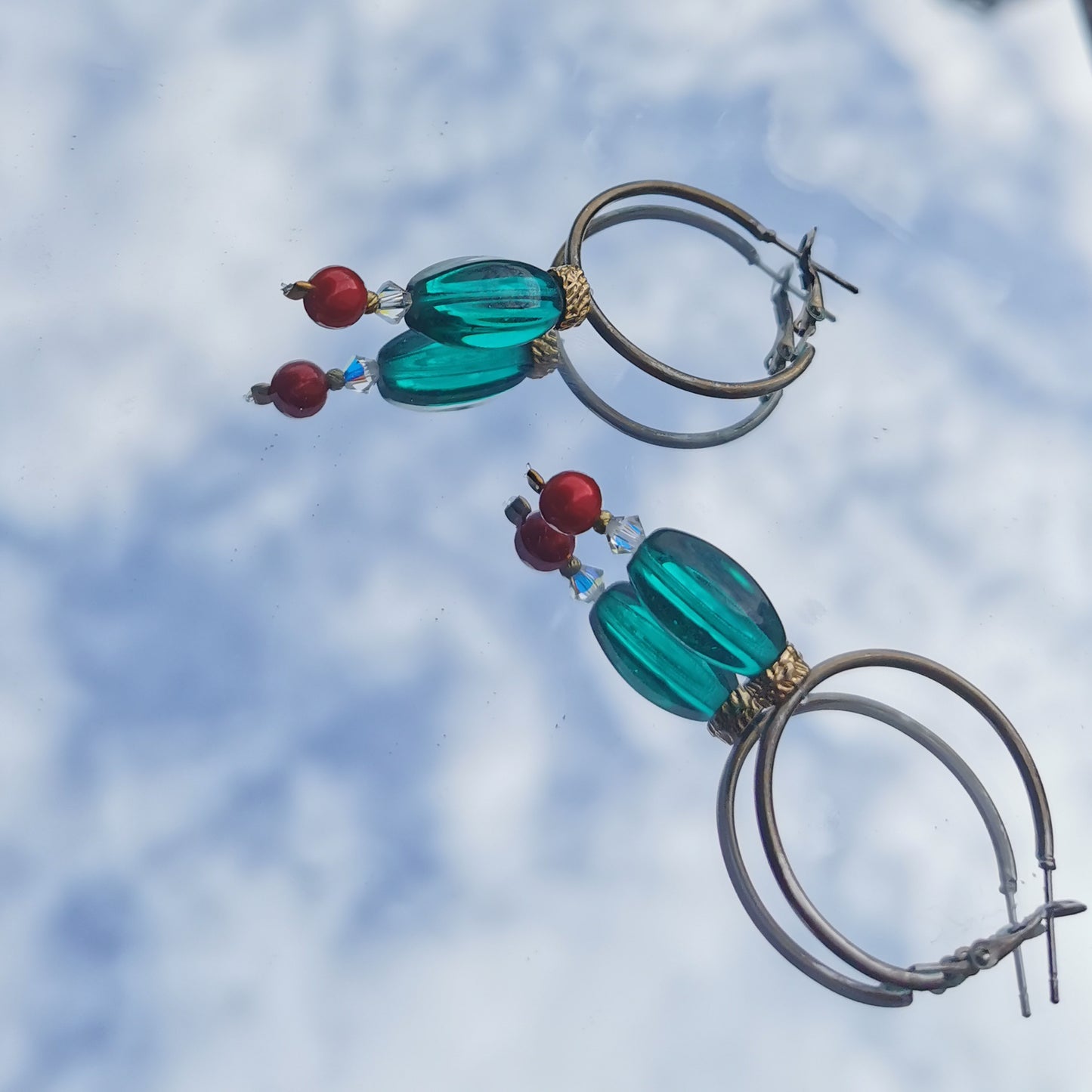 3cm hoops with green beads, gold detail, Swarowski crystal and boheme red pearl  photographed on mirror 