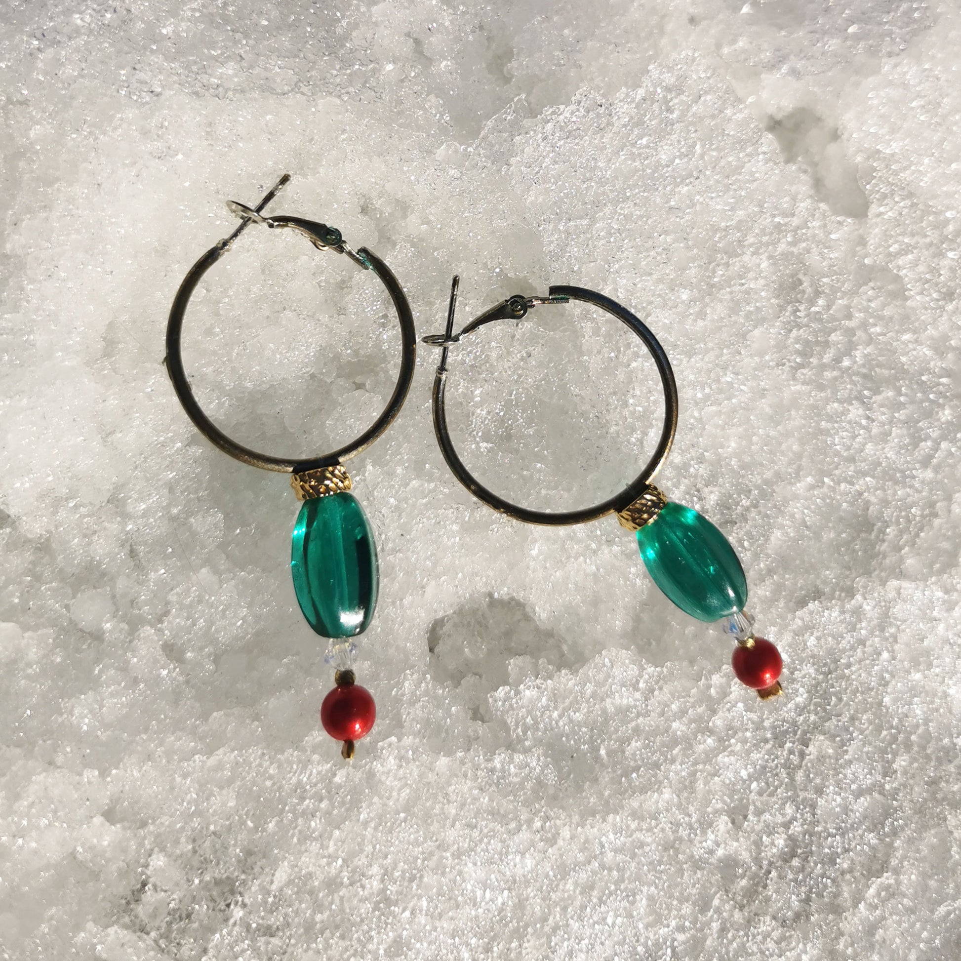 3cm hoops with green beads, gold detail, Swarowski crystal and boheme red pearl pictured in the snow