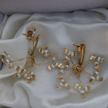 Load image into Gallery viewer, vintage pearls and brass handmade earrings on silk background
