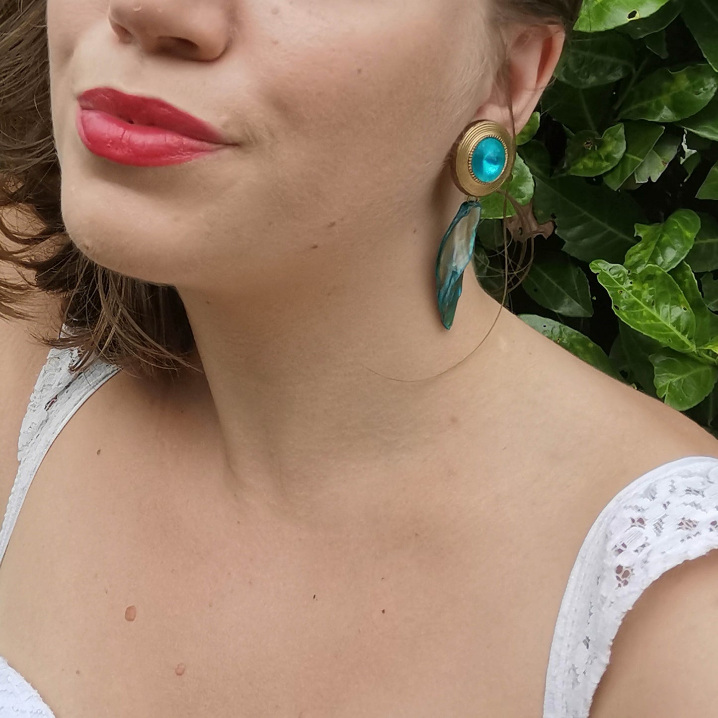 Shell and turquoise gold stud earrings worn on 