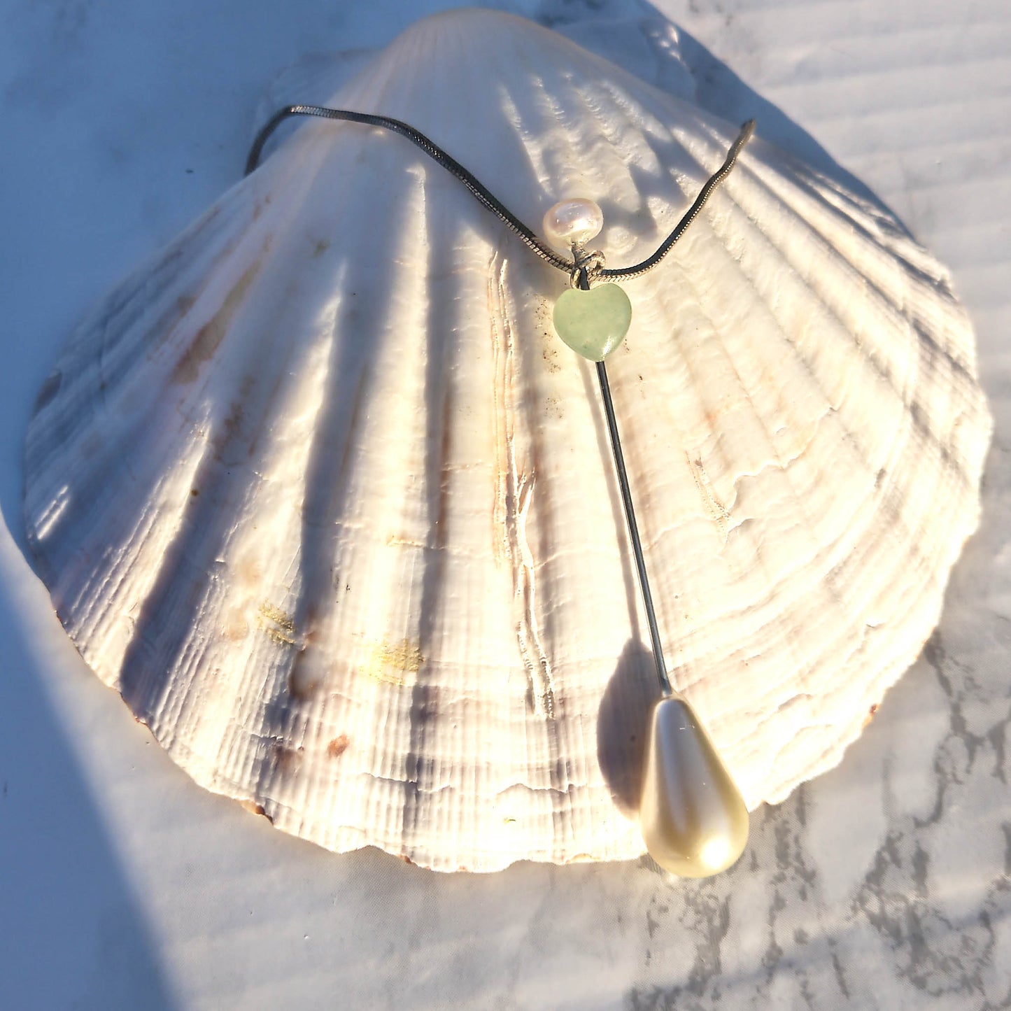 Teardrop pearl pendant with mint heart 