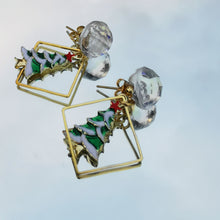 Load image into Gallery viewer, Snowglobe christmas tree earrings reflected in mirror
