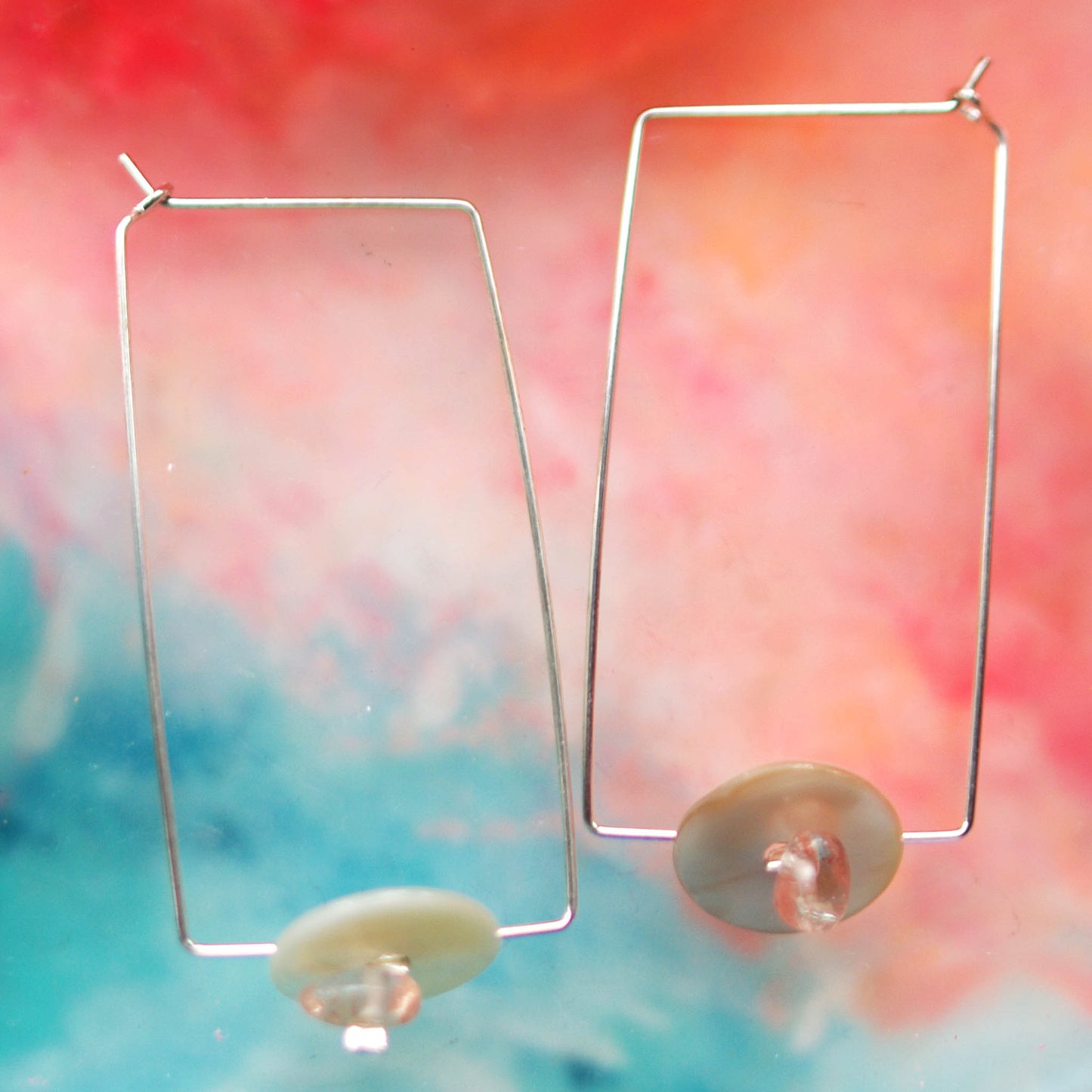 Head over Heels earrings Camifolla background