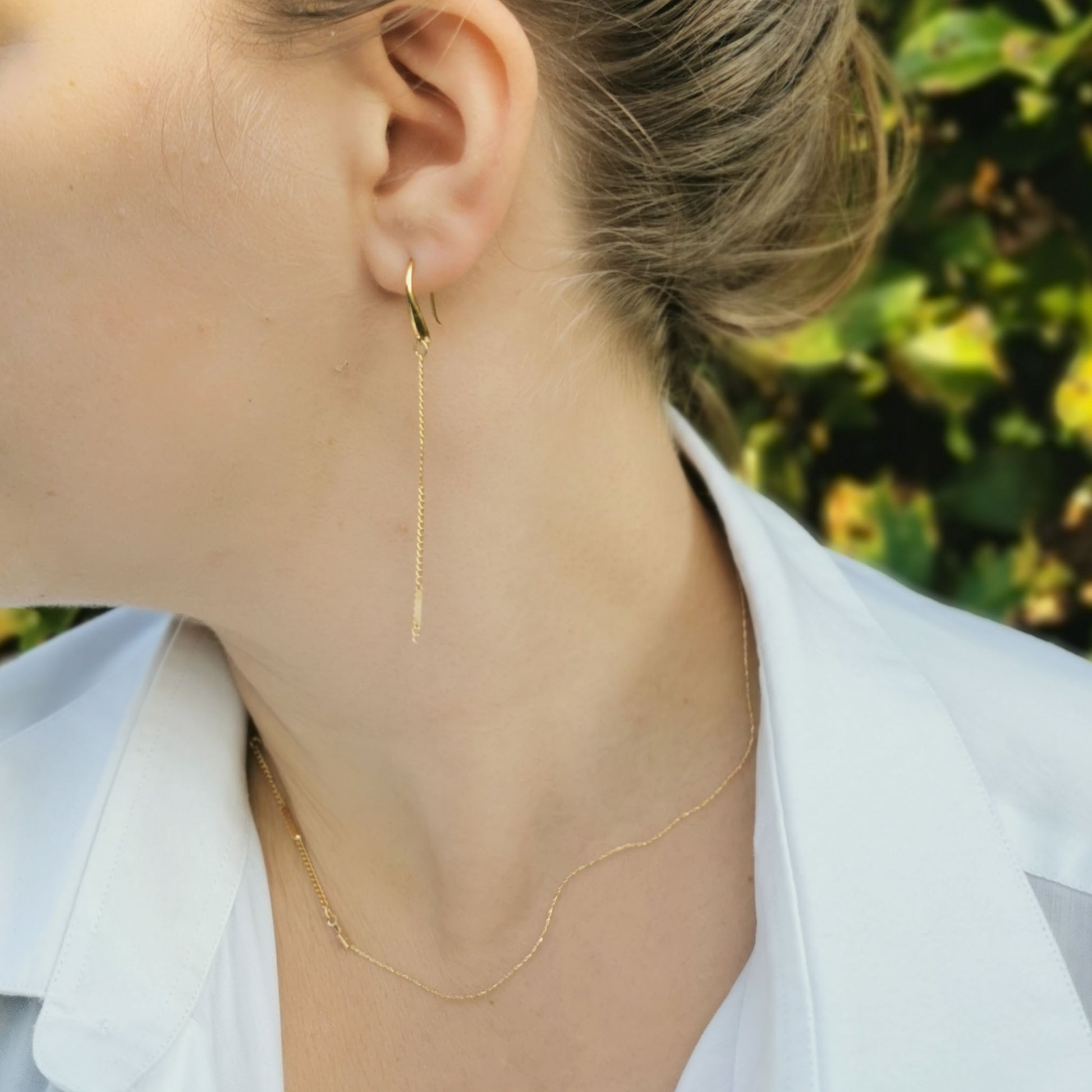 Dangle earrings worn on 